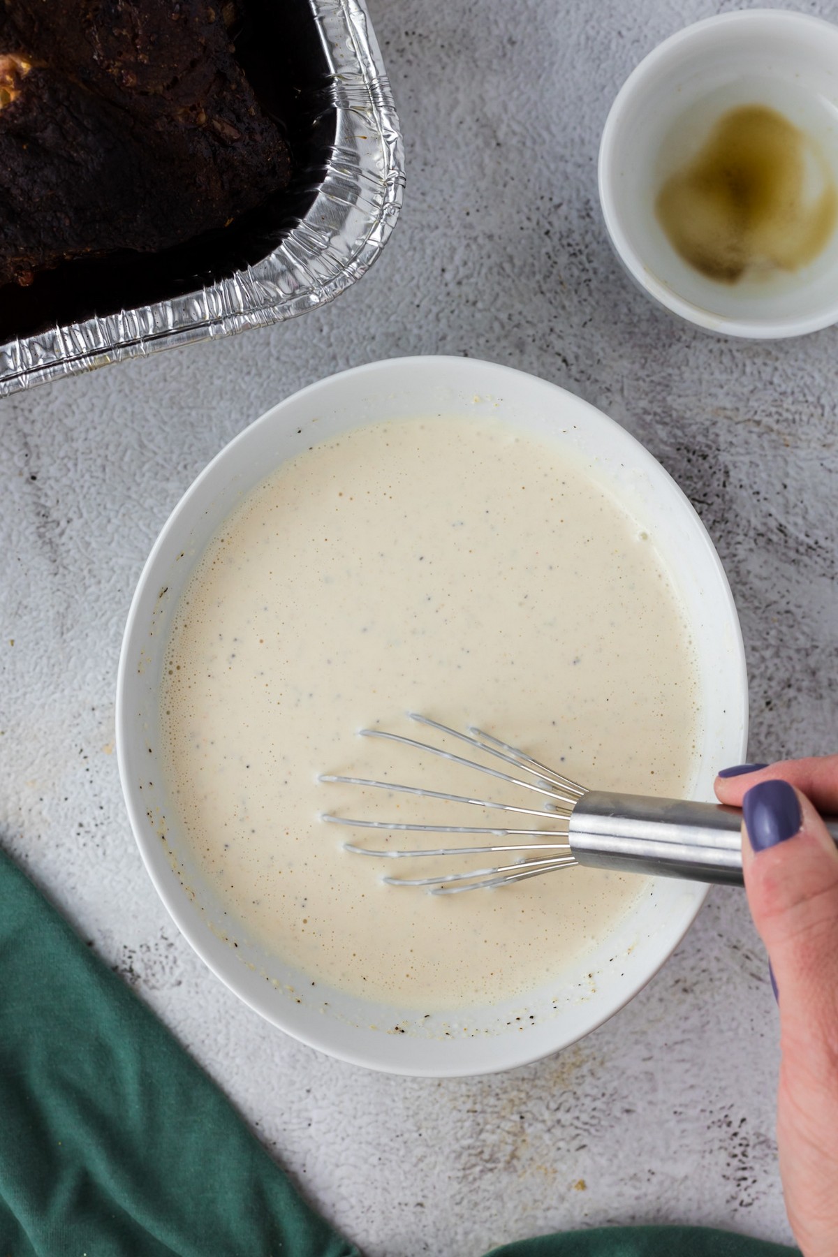 whisking white sauce