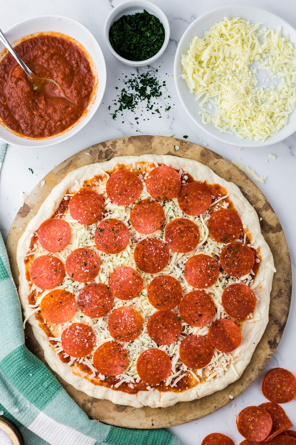 prepared unbaked pizza with ingredients