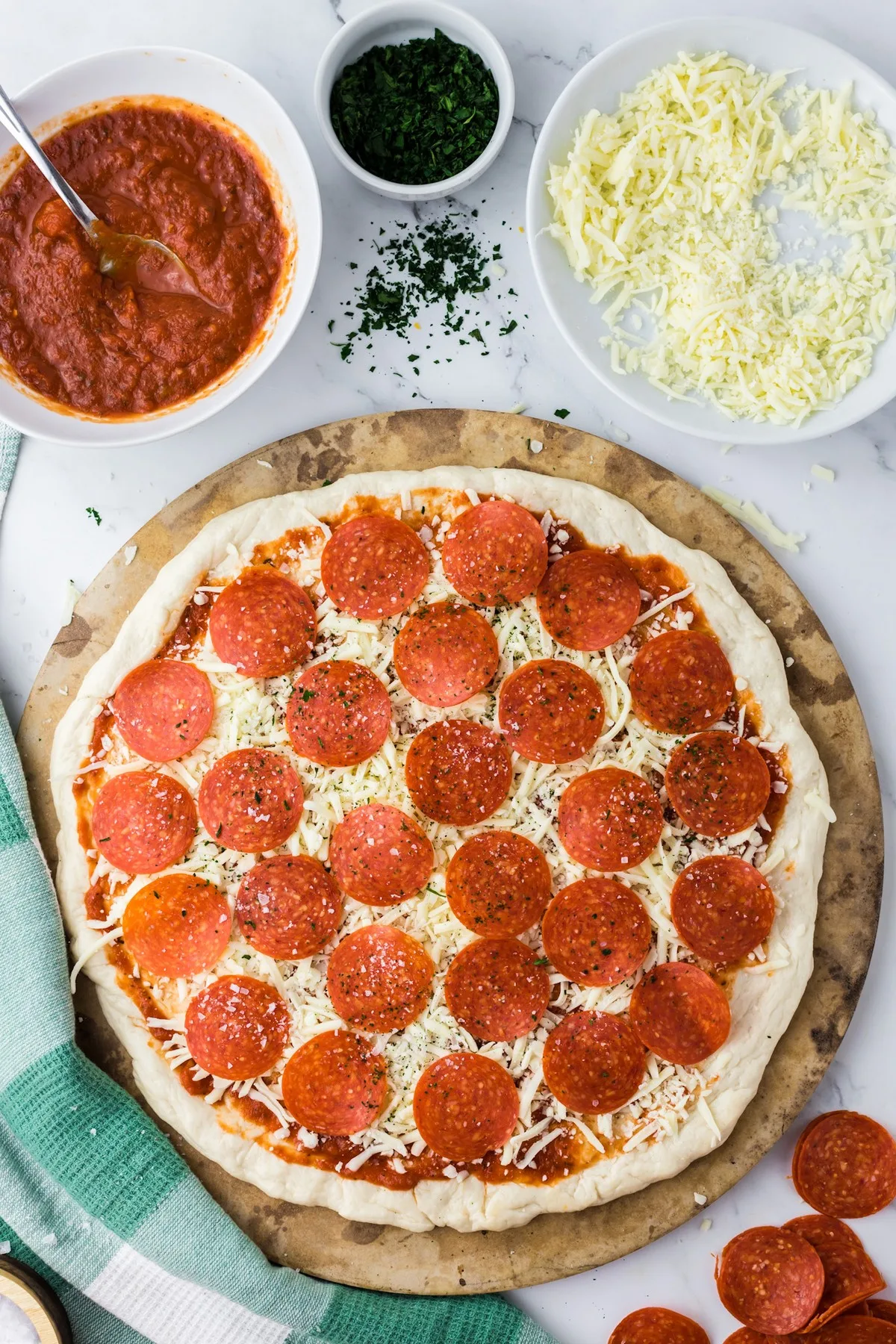 prepared unbaked pizza with ingredients