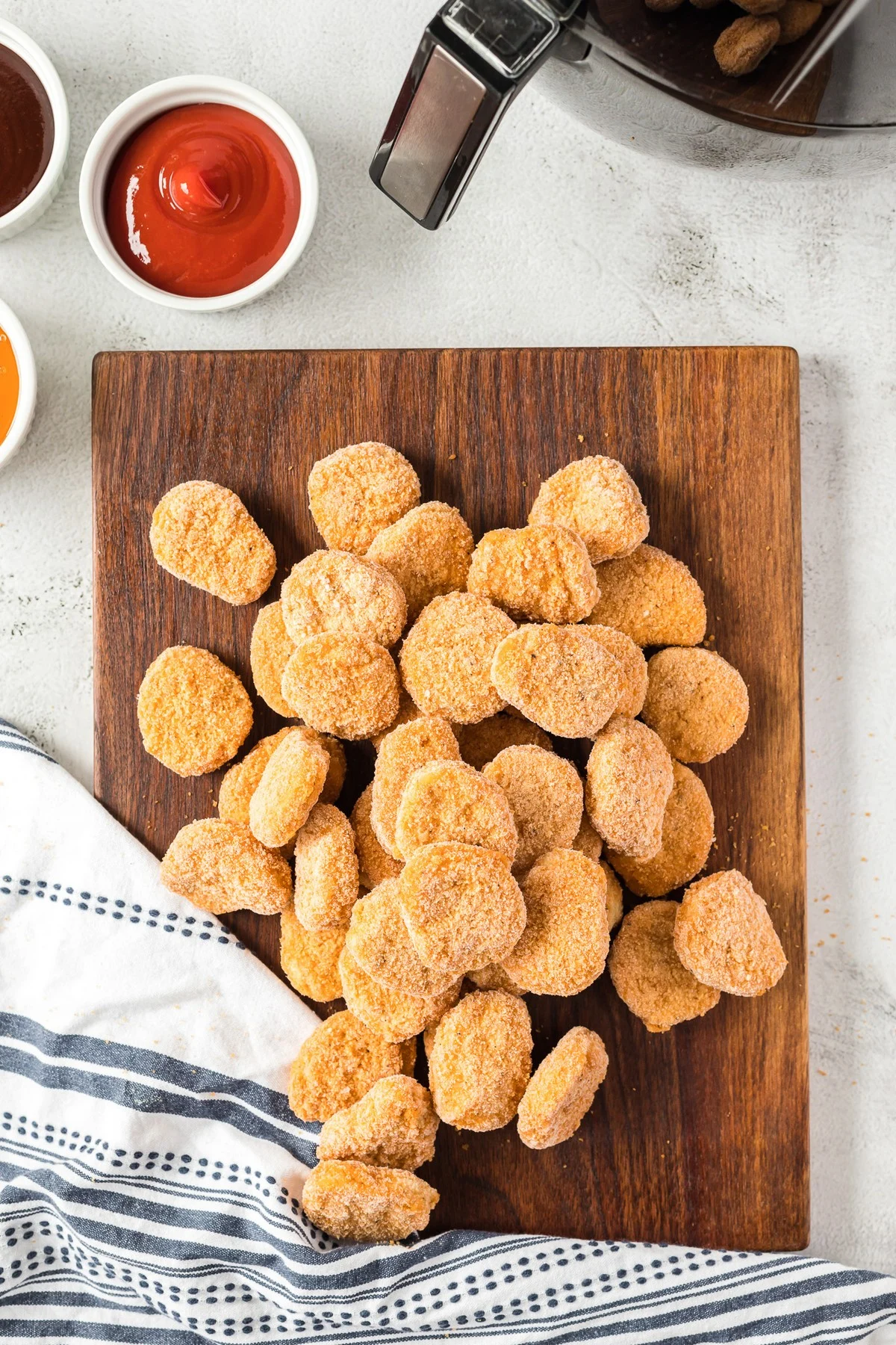 frozen chicken nuggets on cutting board