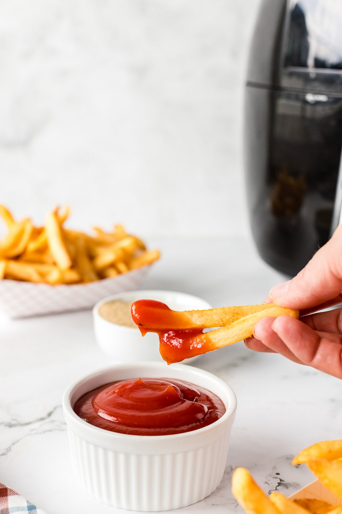dipping fries in ketchup