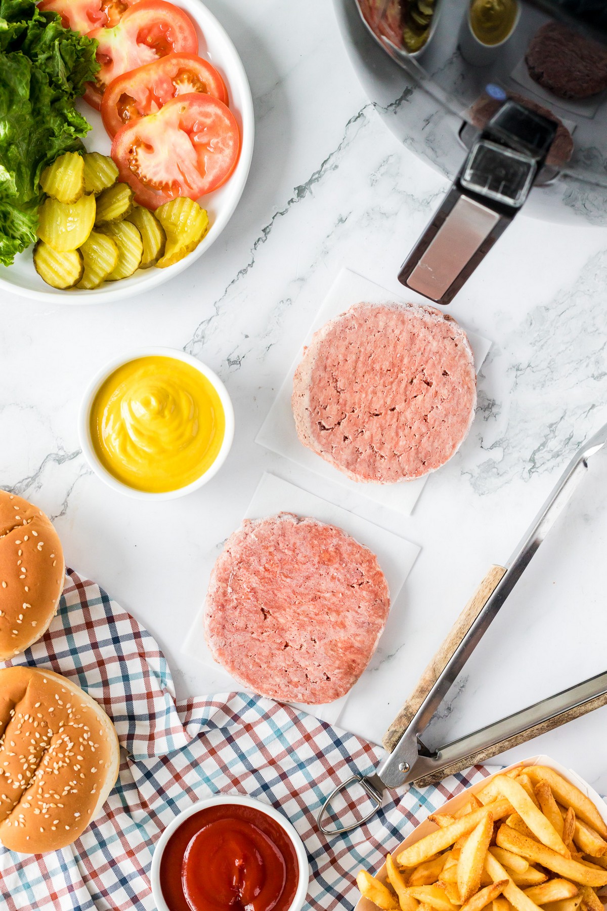 frozen hamburger patties with burger condiments