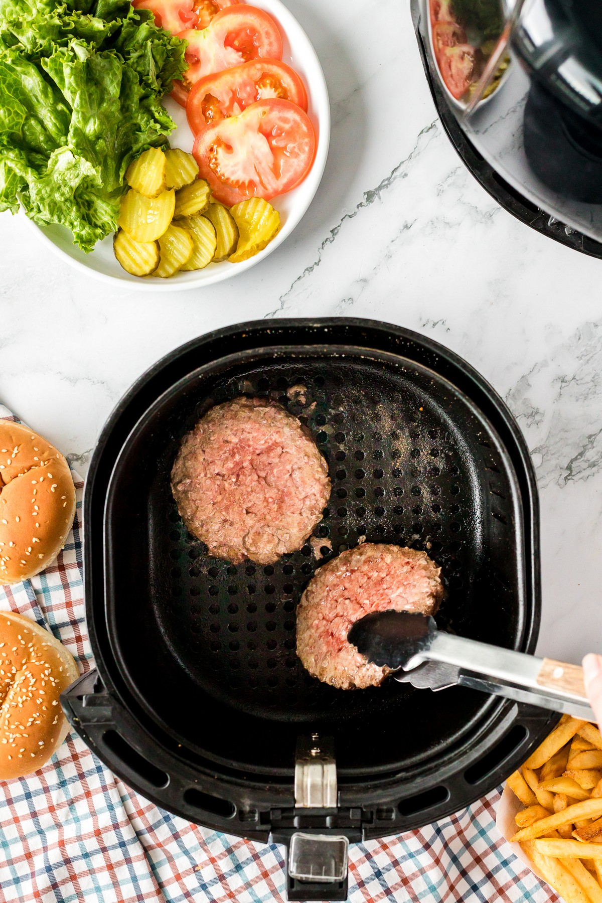 flipping beef patties in the air fryer