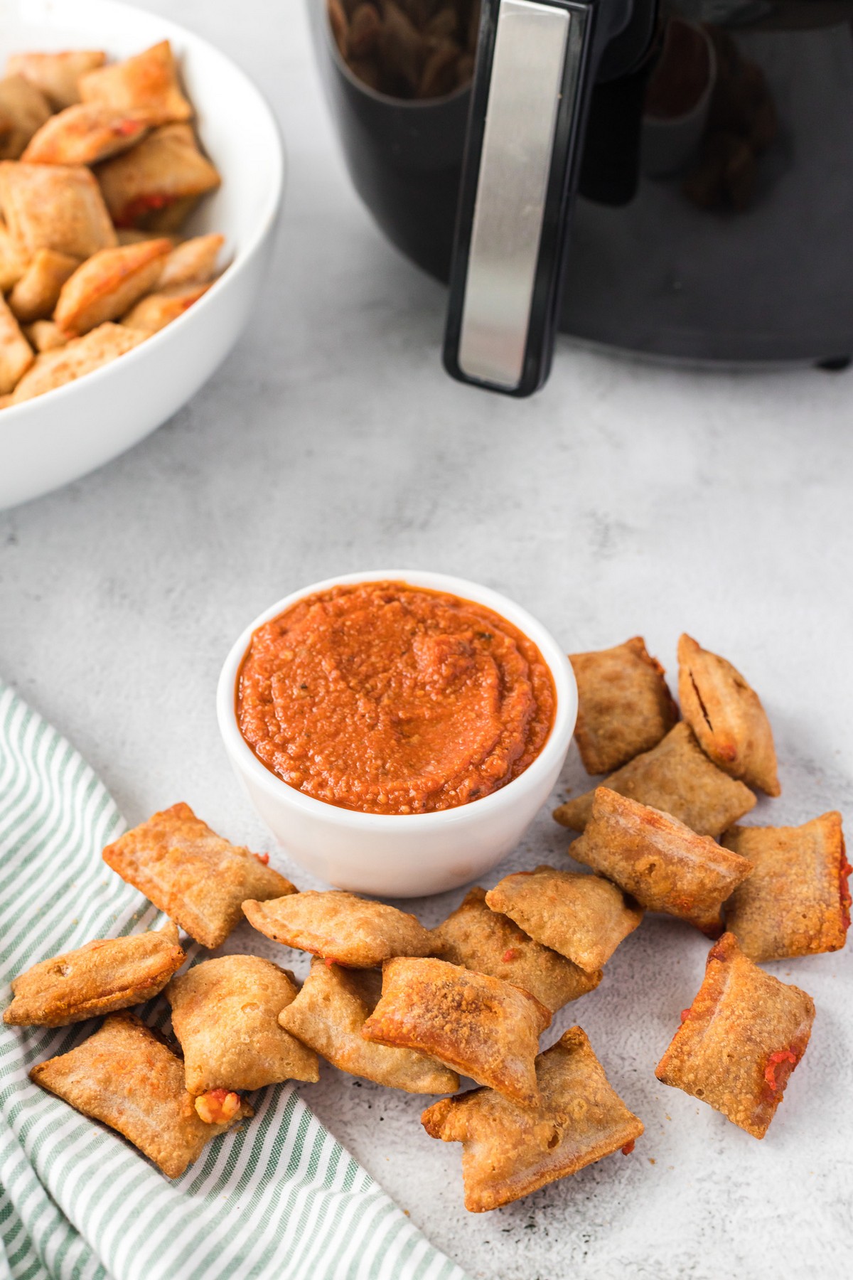 pizza rolls on table with sauce