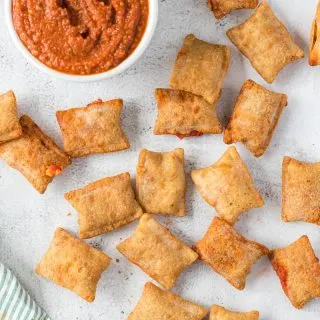 pizza rolls scattered around sauce