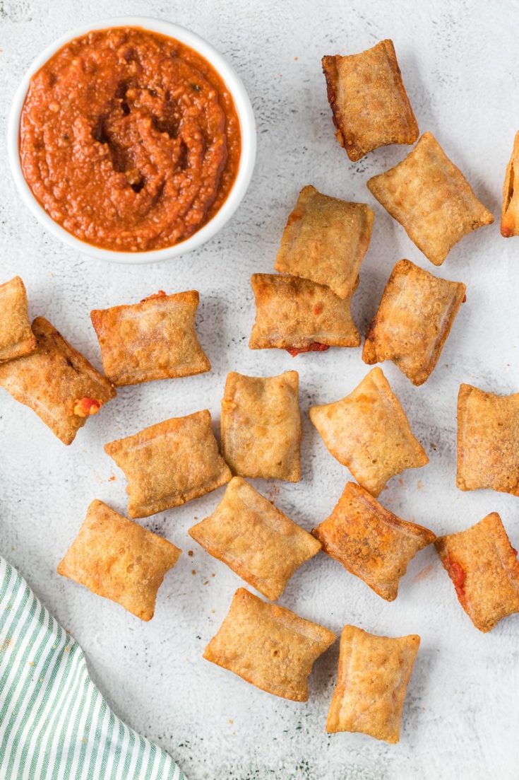 pizza rolls scattered around sauce