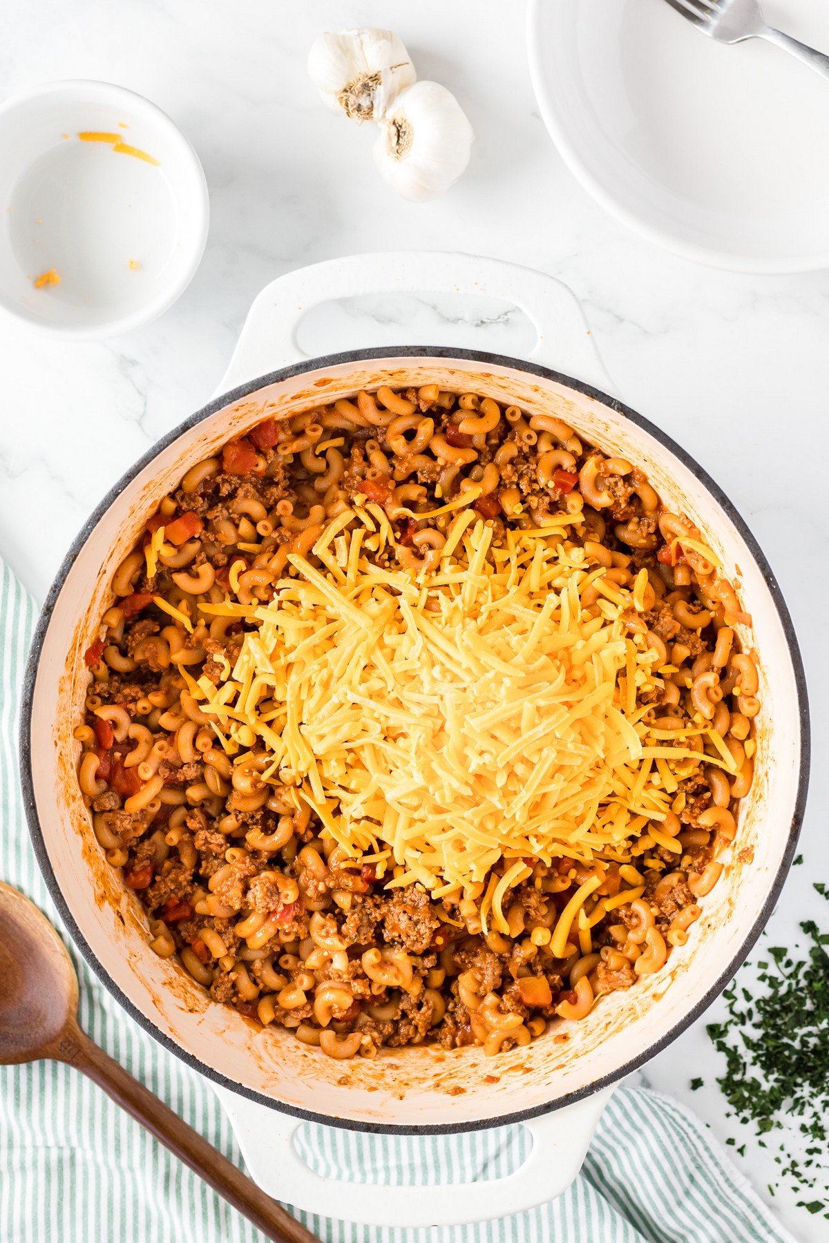 goulash recipe with shredded cheese on top