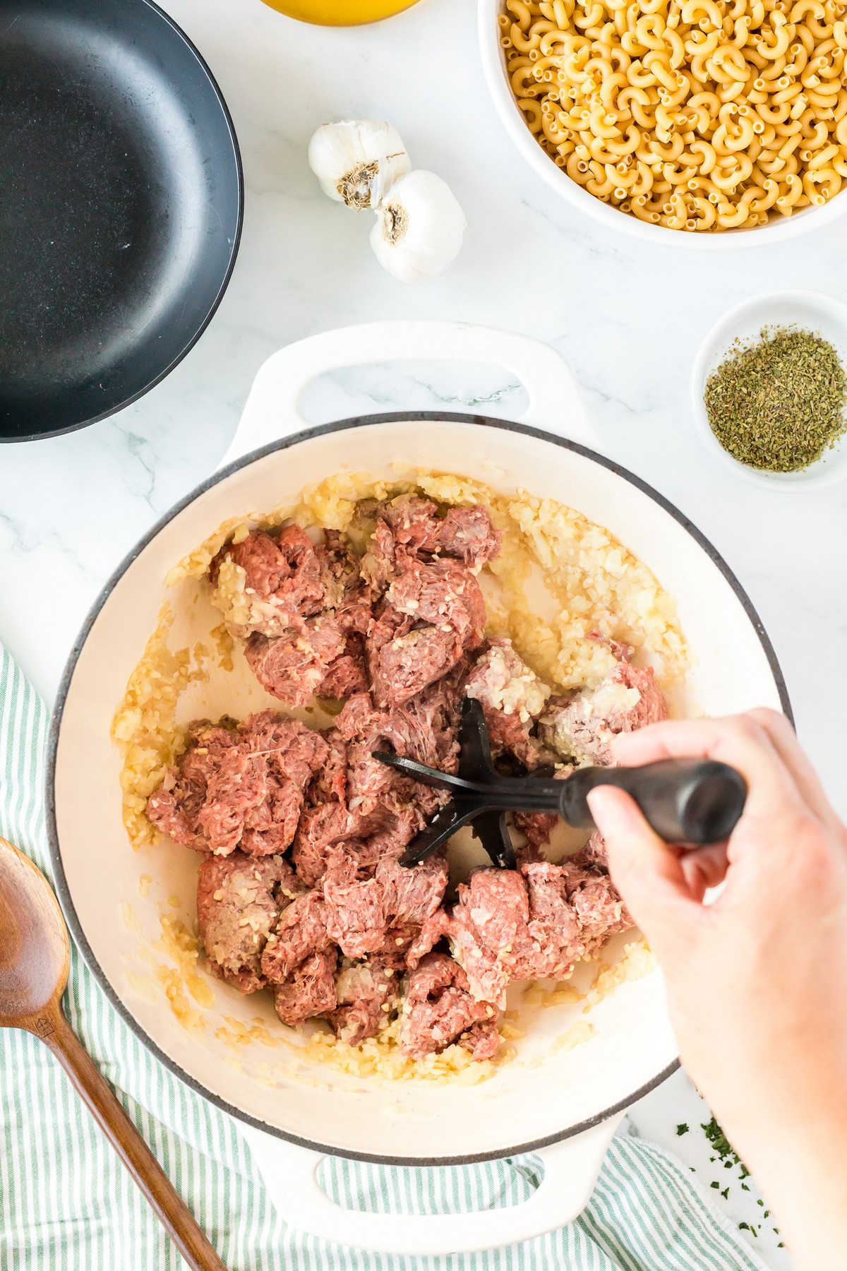 breaking up ground beef in pot