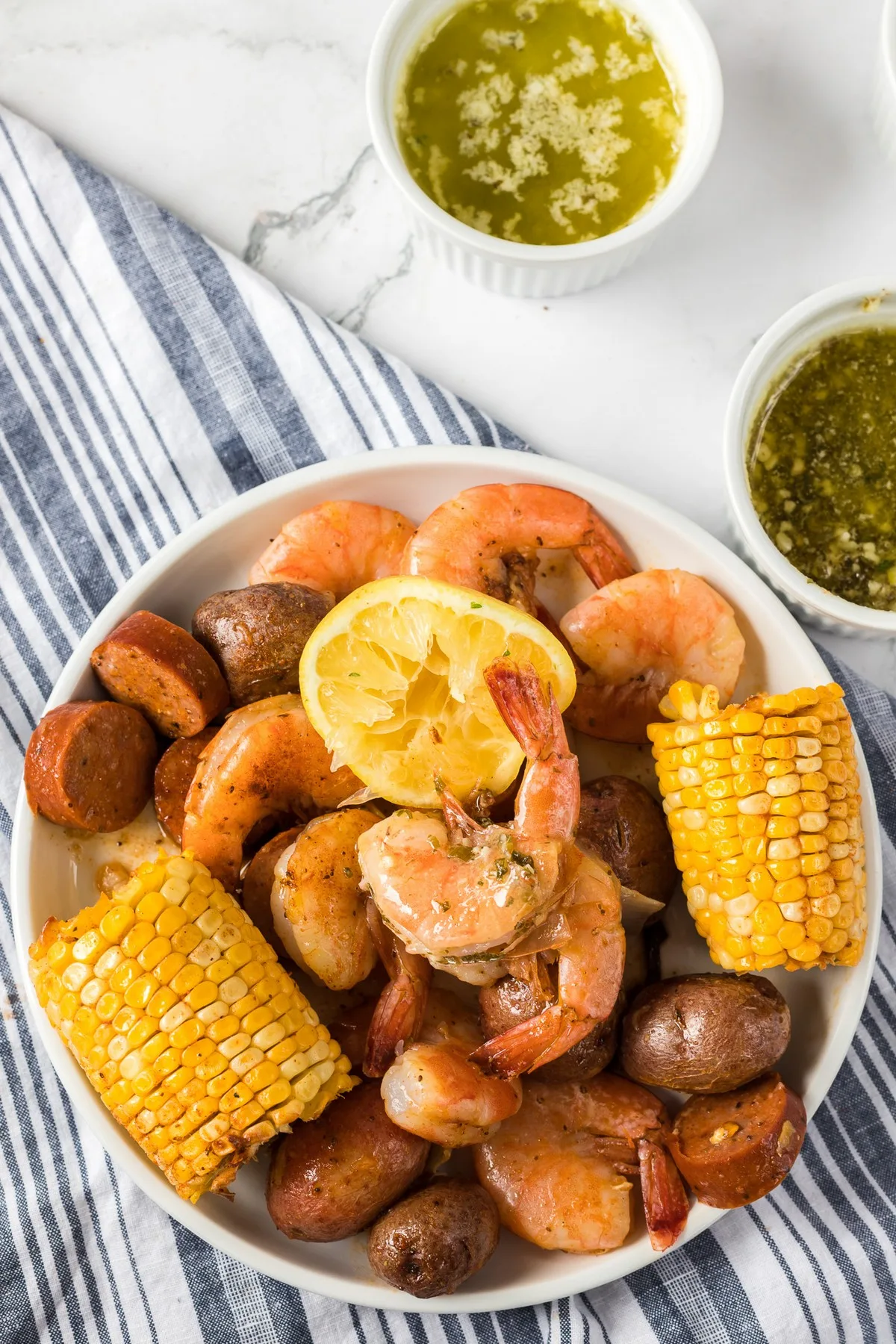 bowl of seafood boil with sauce for dipping