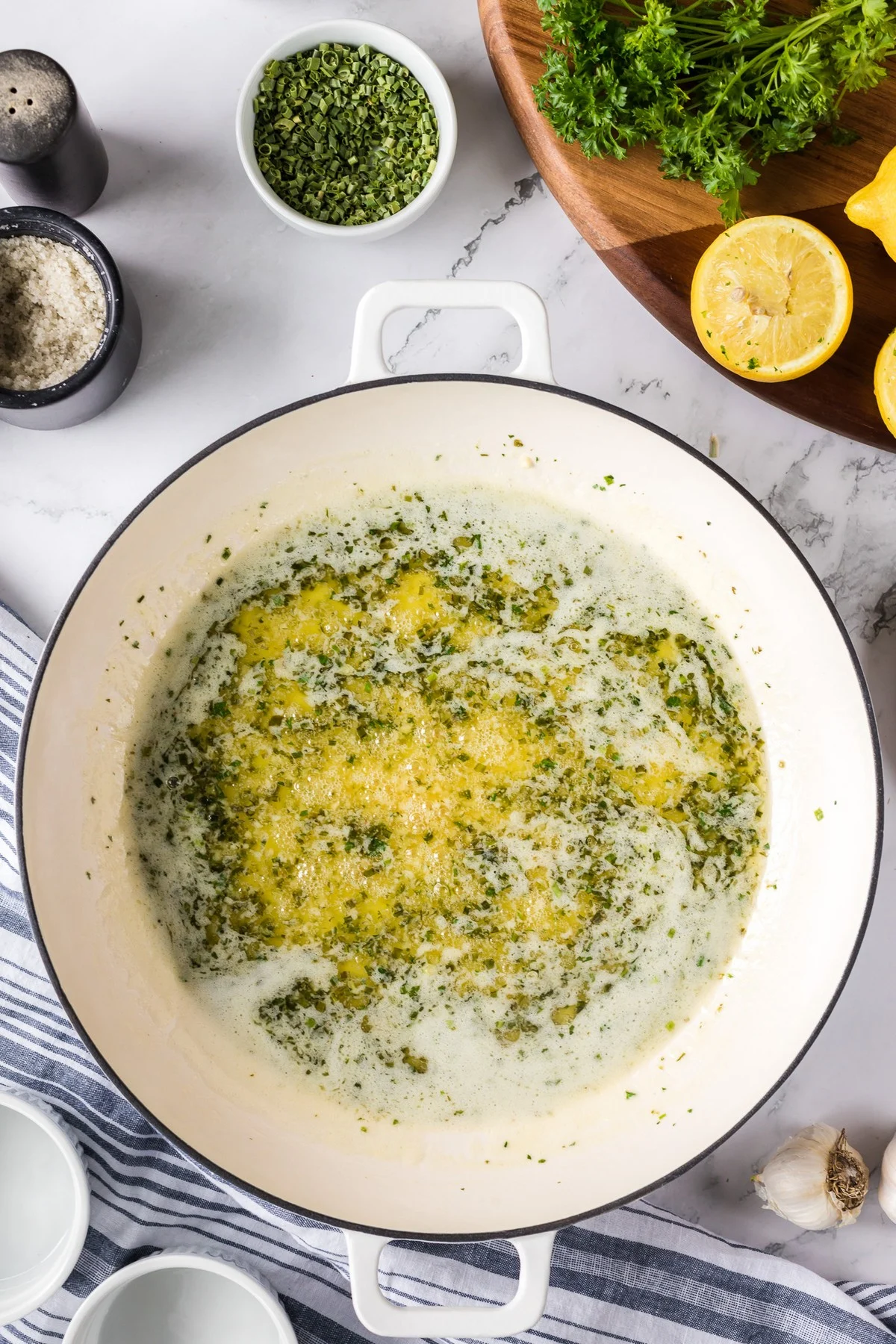 melted butter and herbs in sauce pan