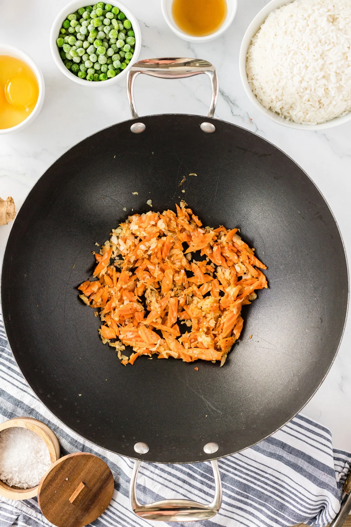 carrots and onion in wok for fried rice