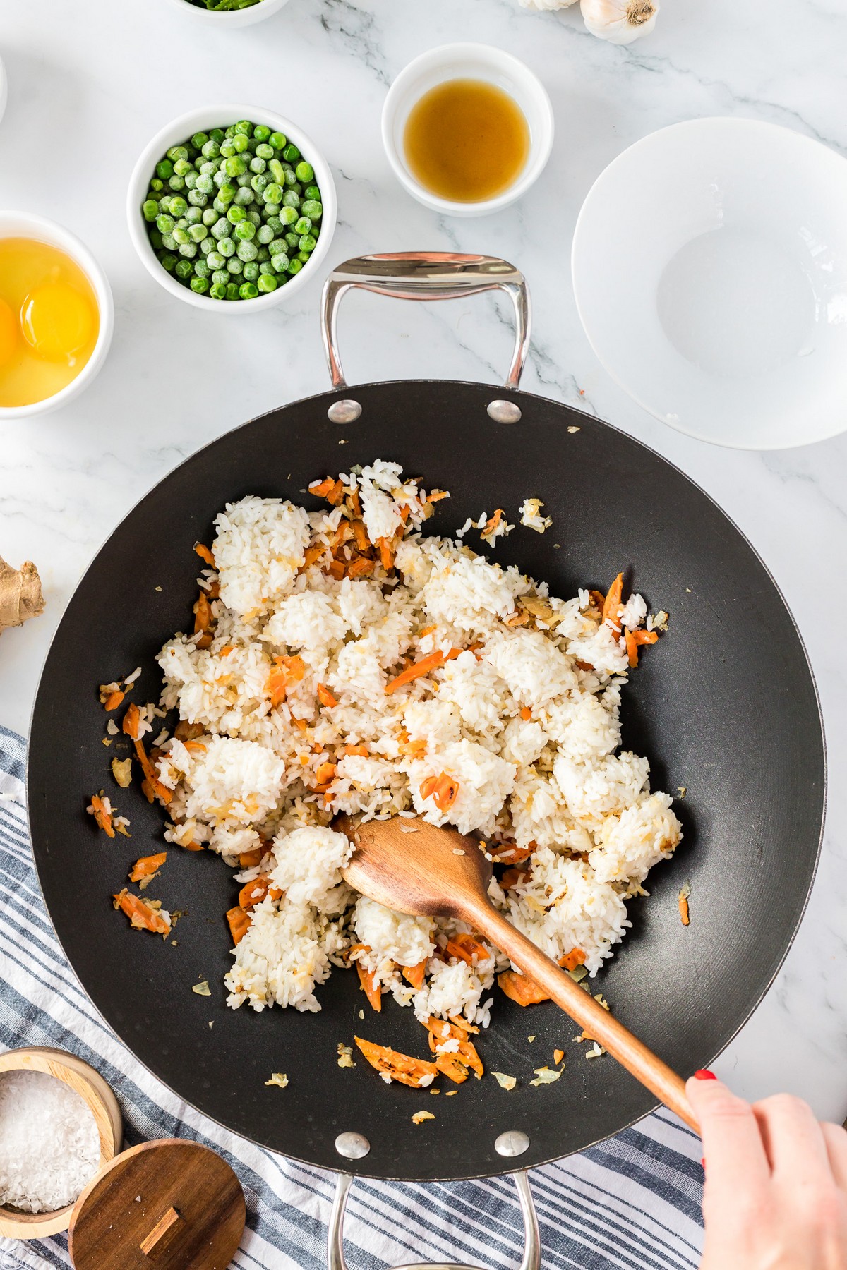 stirring rice into wok