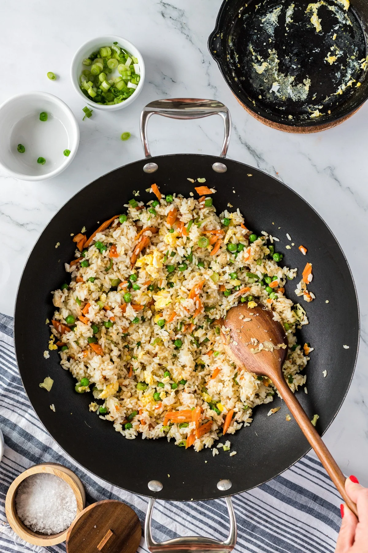 stirring fried rice mixture in wok