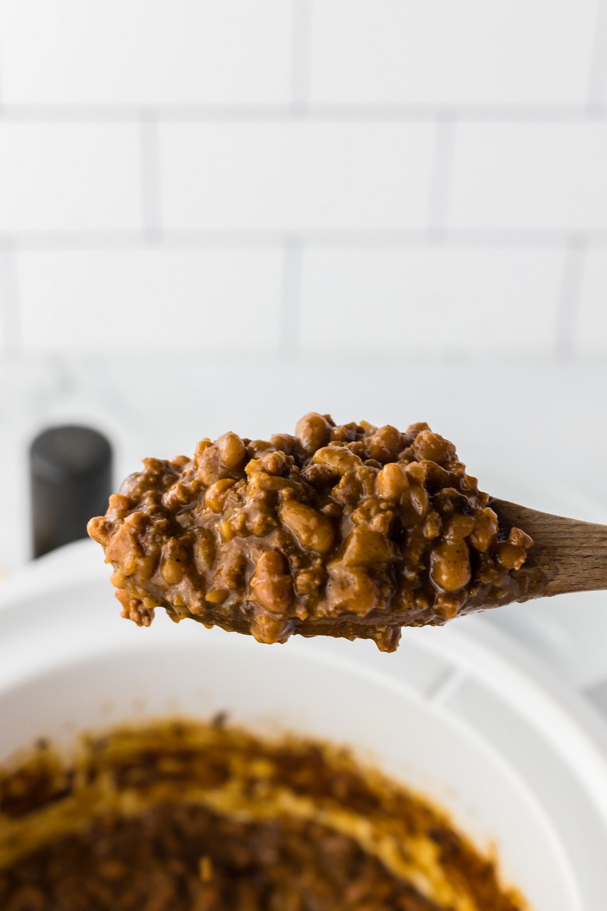 spoonful of baked beans with ground beef