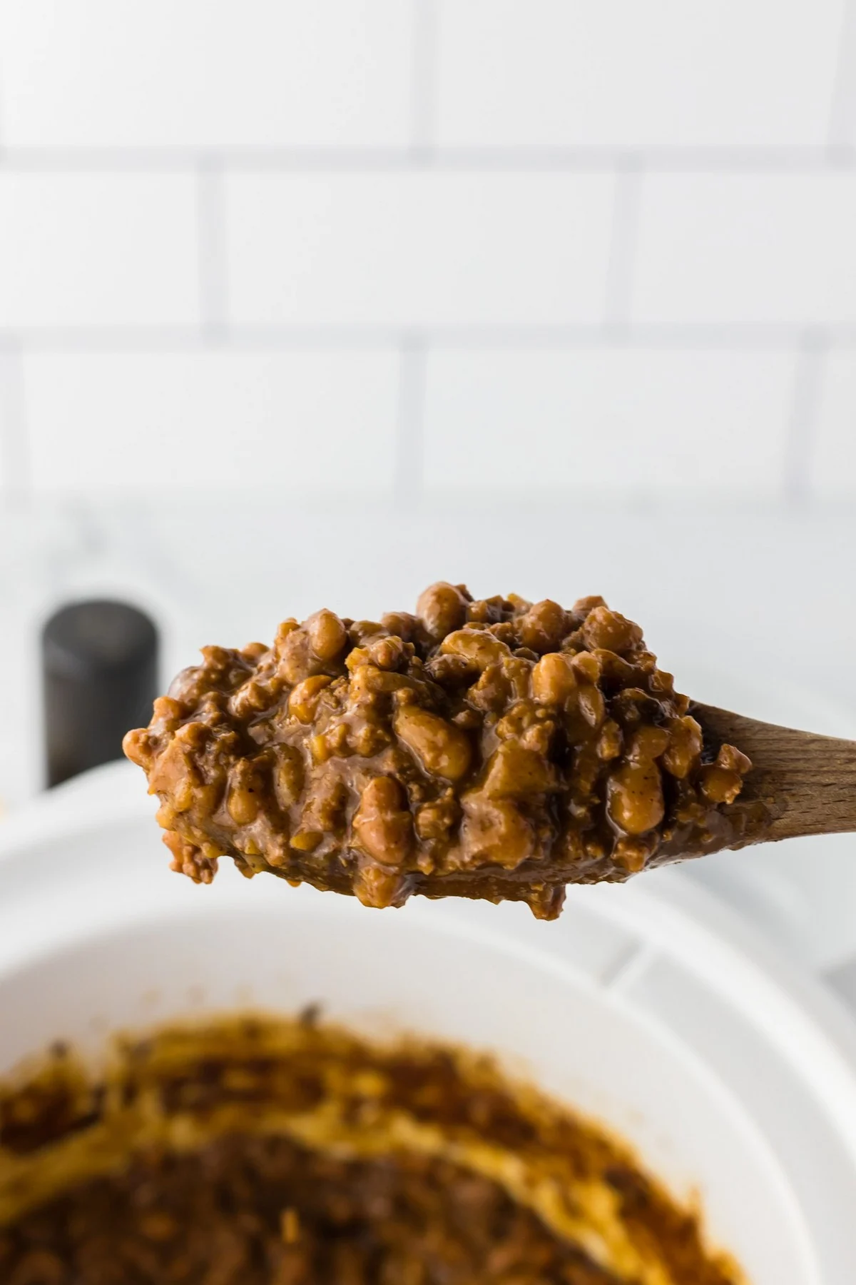 spoonful of baked beans with ground beef