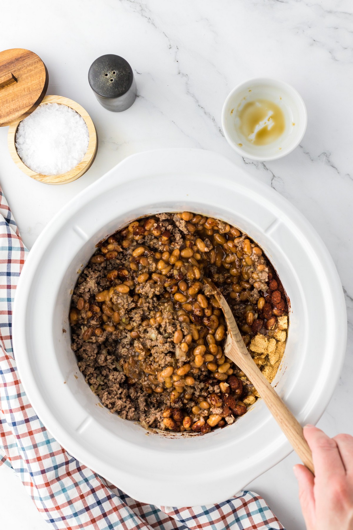 combining ingredients for southern style bbq baked beans