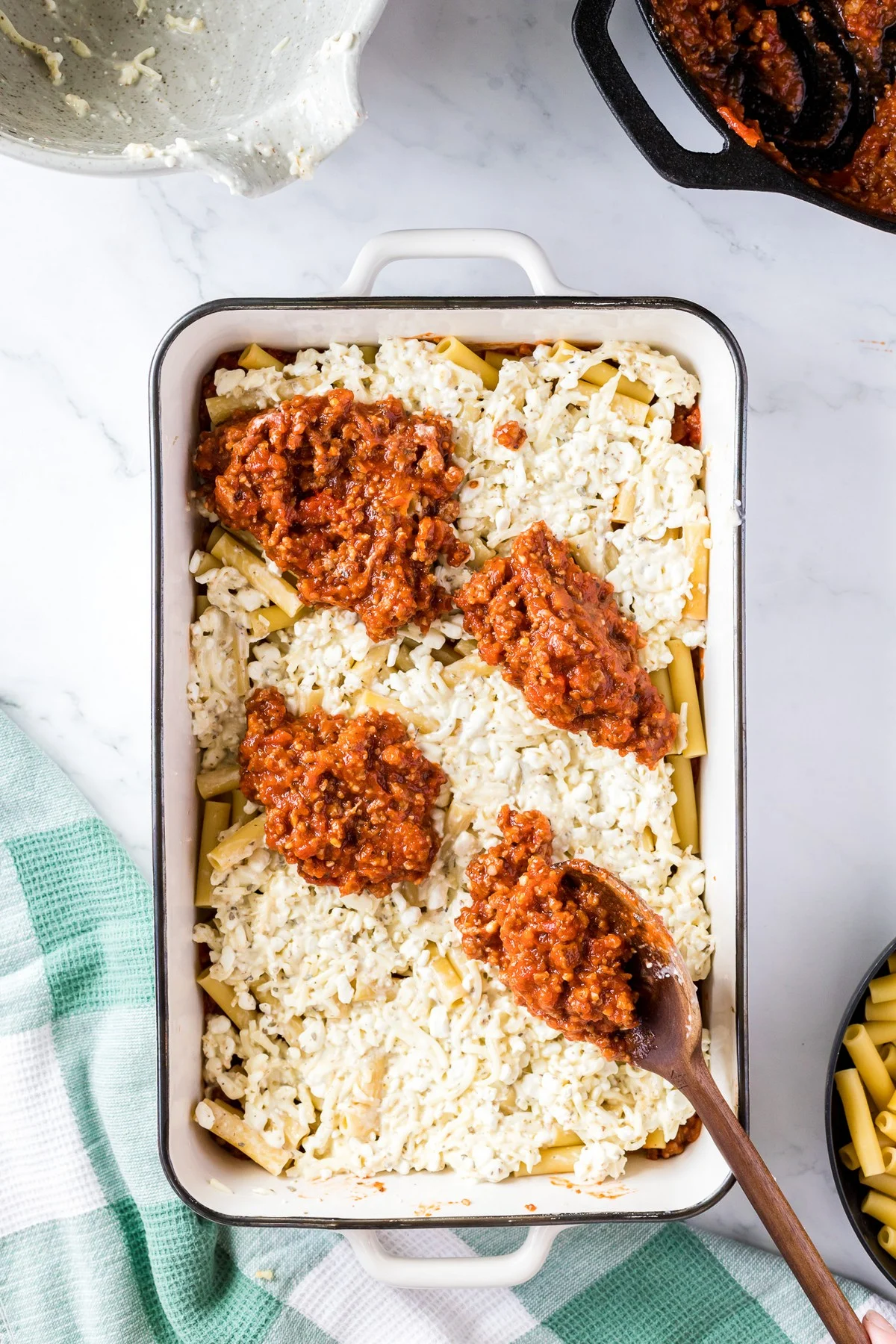 assembling layered baked ziti