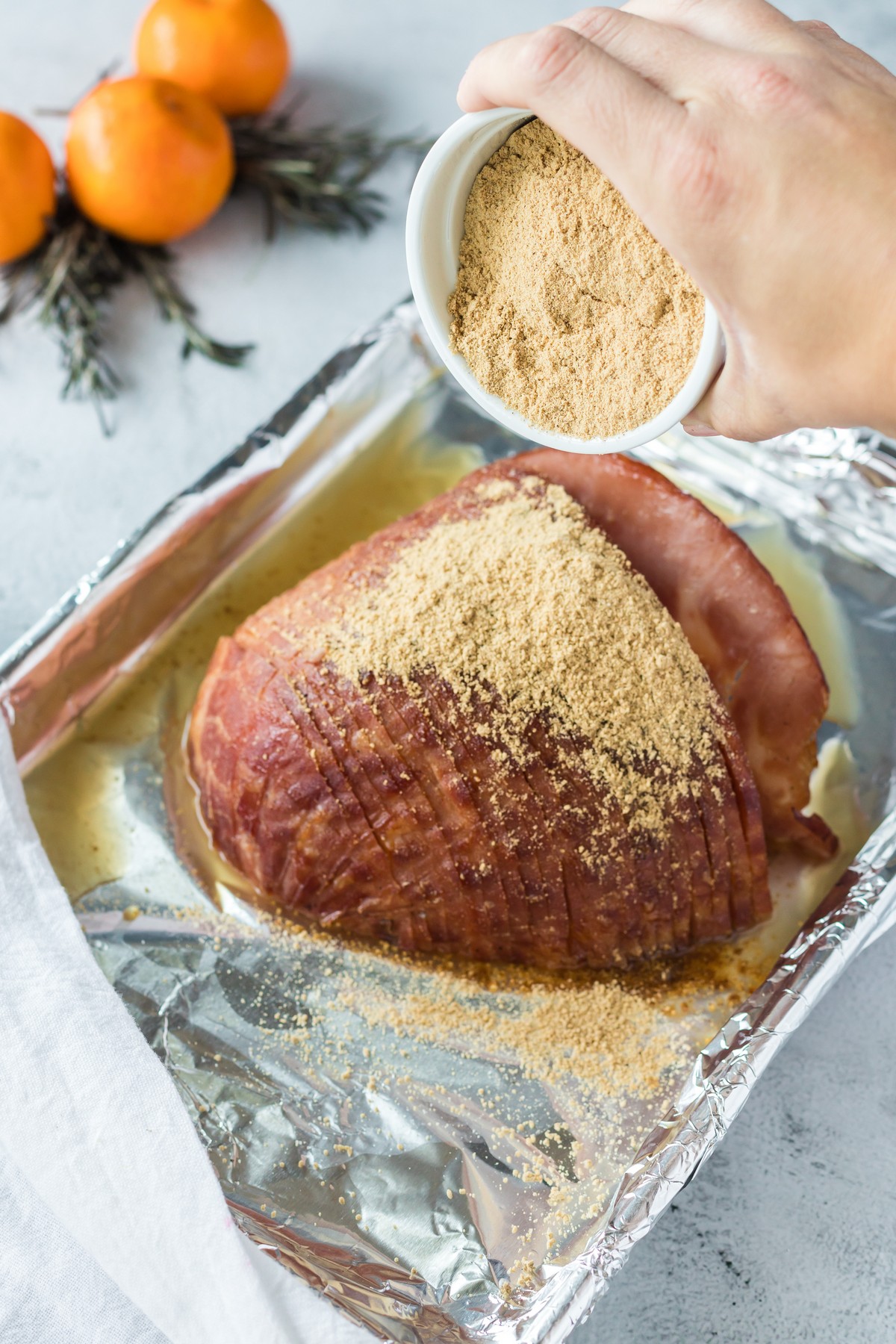 adding brown sugar to top of ham