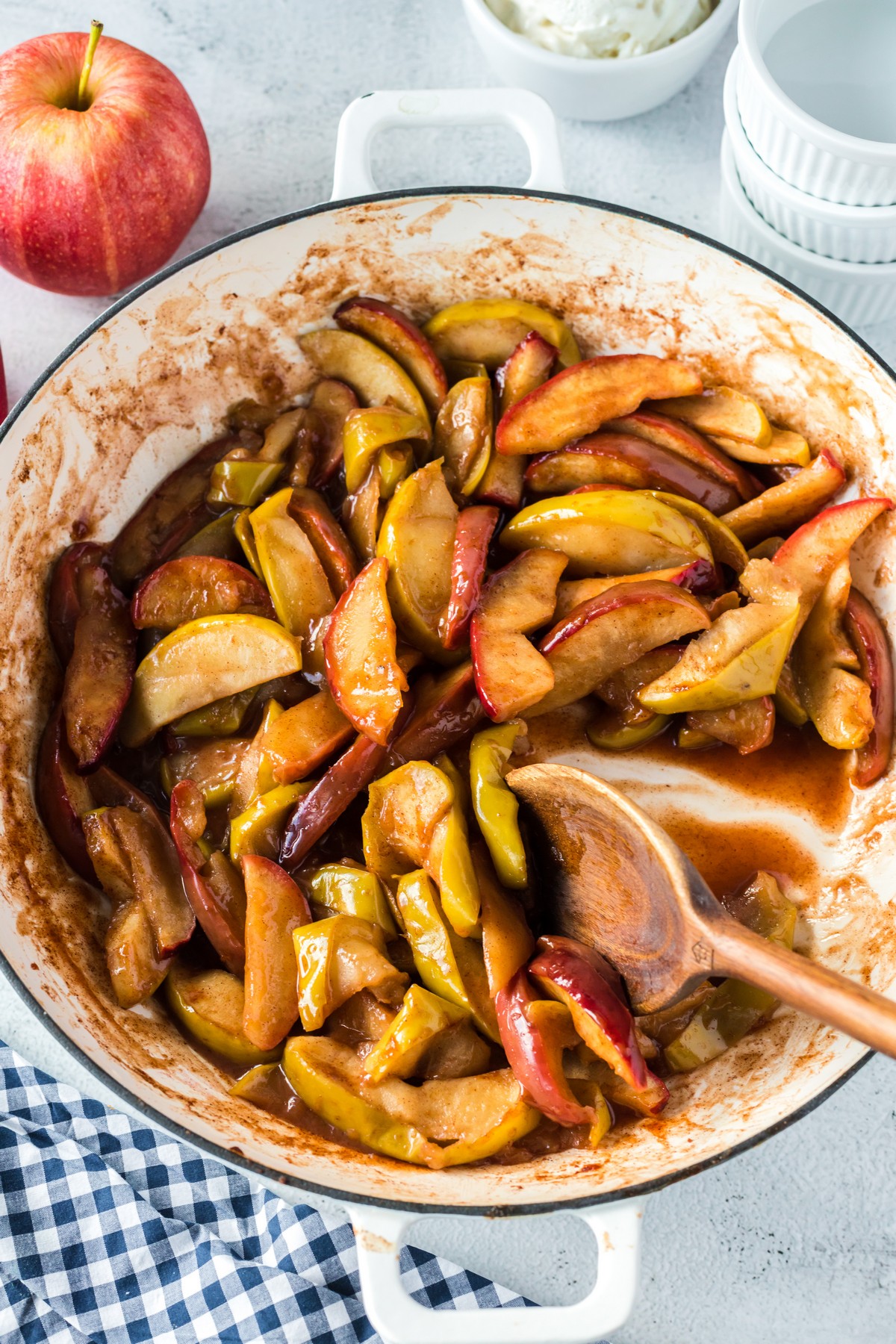 stirring baked cinnamon apples