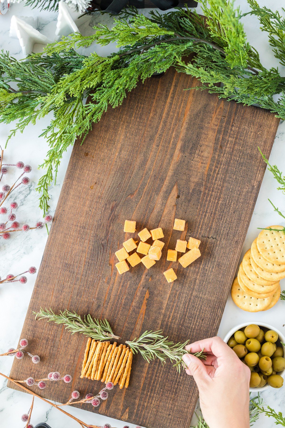 Christmas Charcuterie Board branches with rosemary