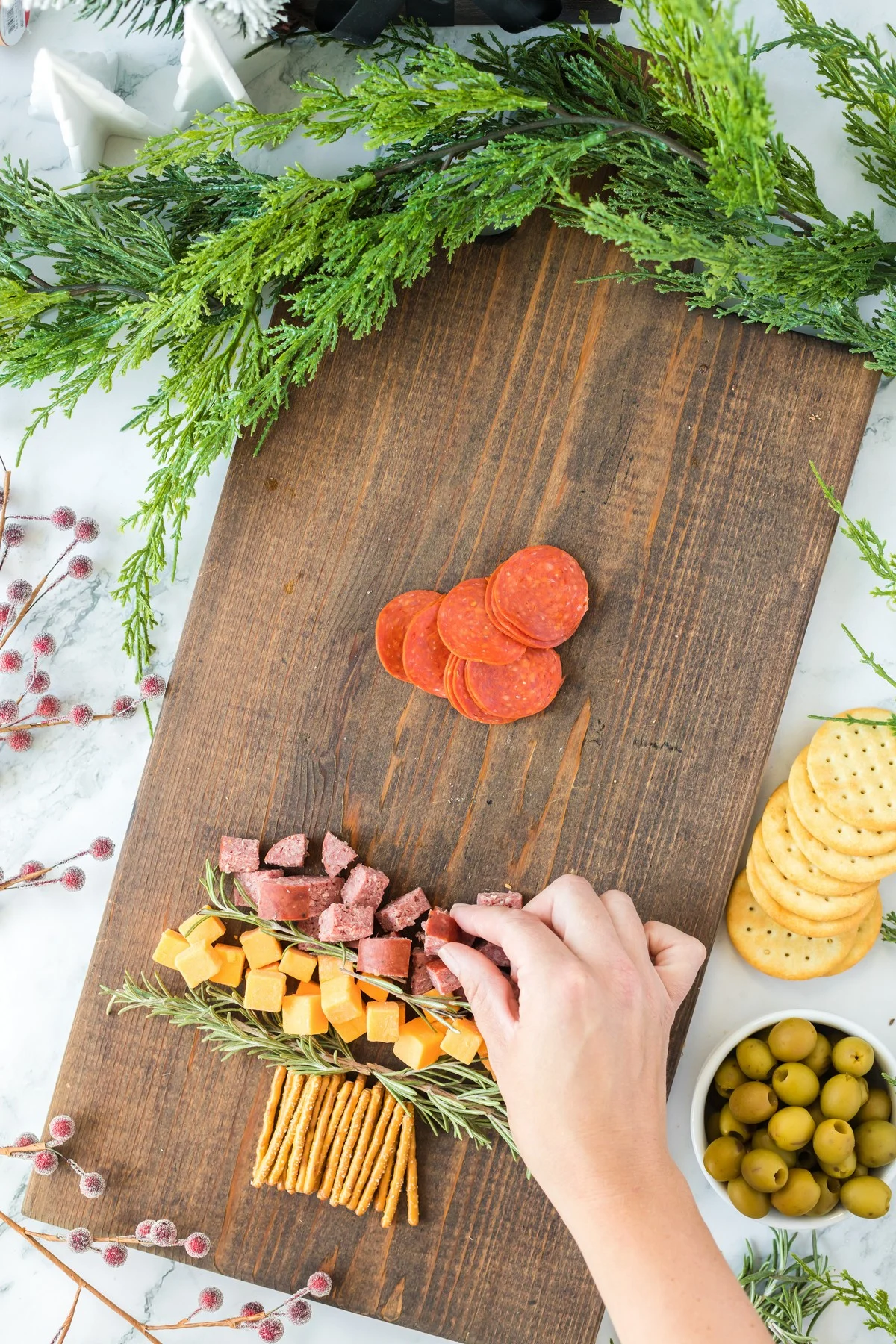 layering meats on a Christmas Charcuterie Board