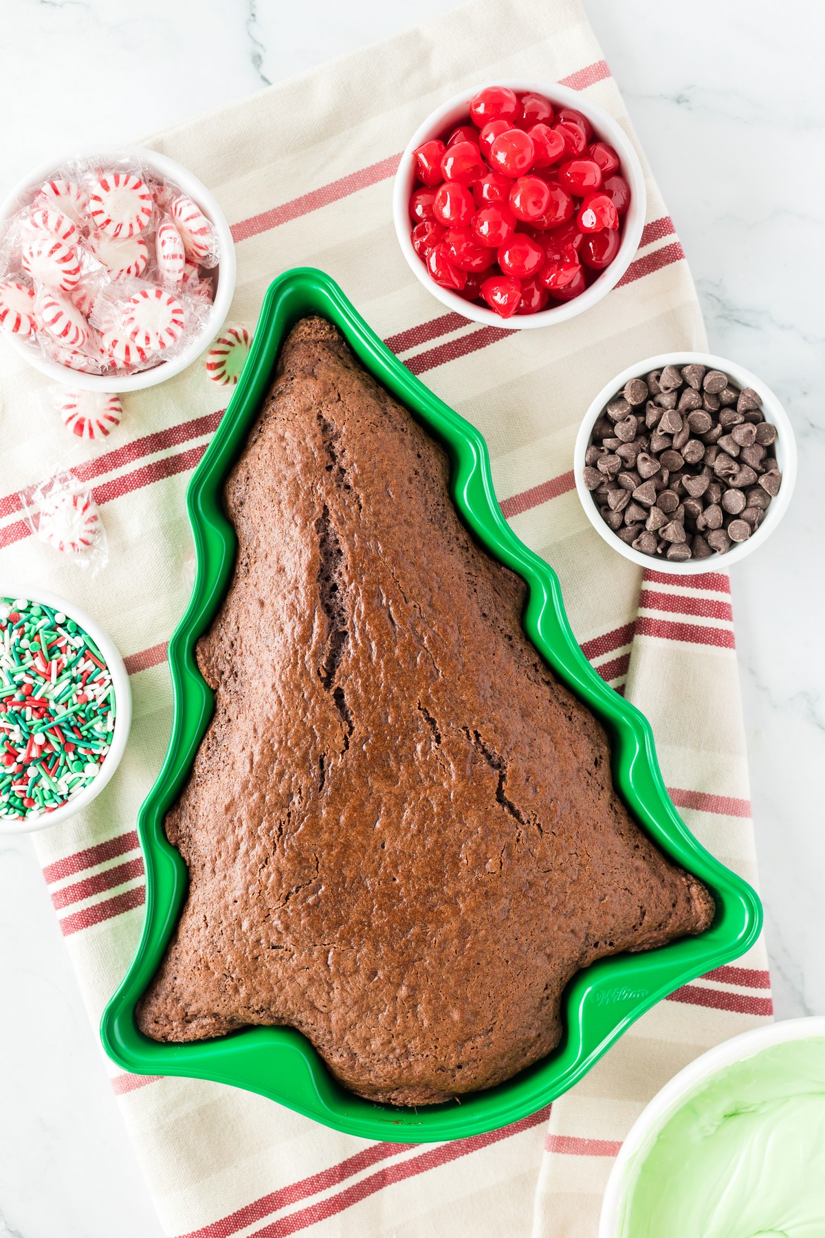 baked cake cooling in christmas tree shaped cake mold