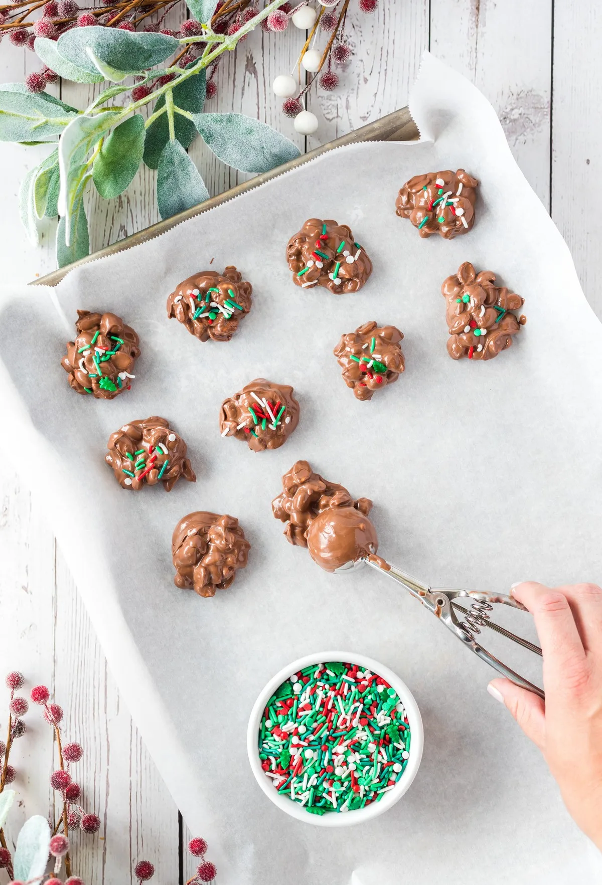 scooping crockpot christmas crack mixture