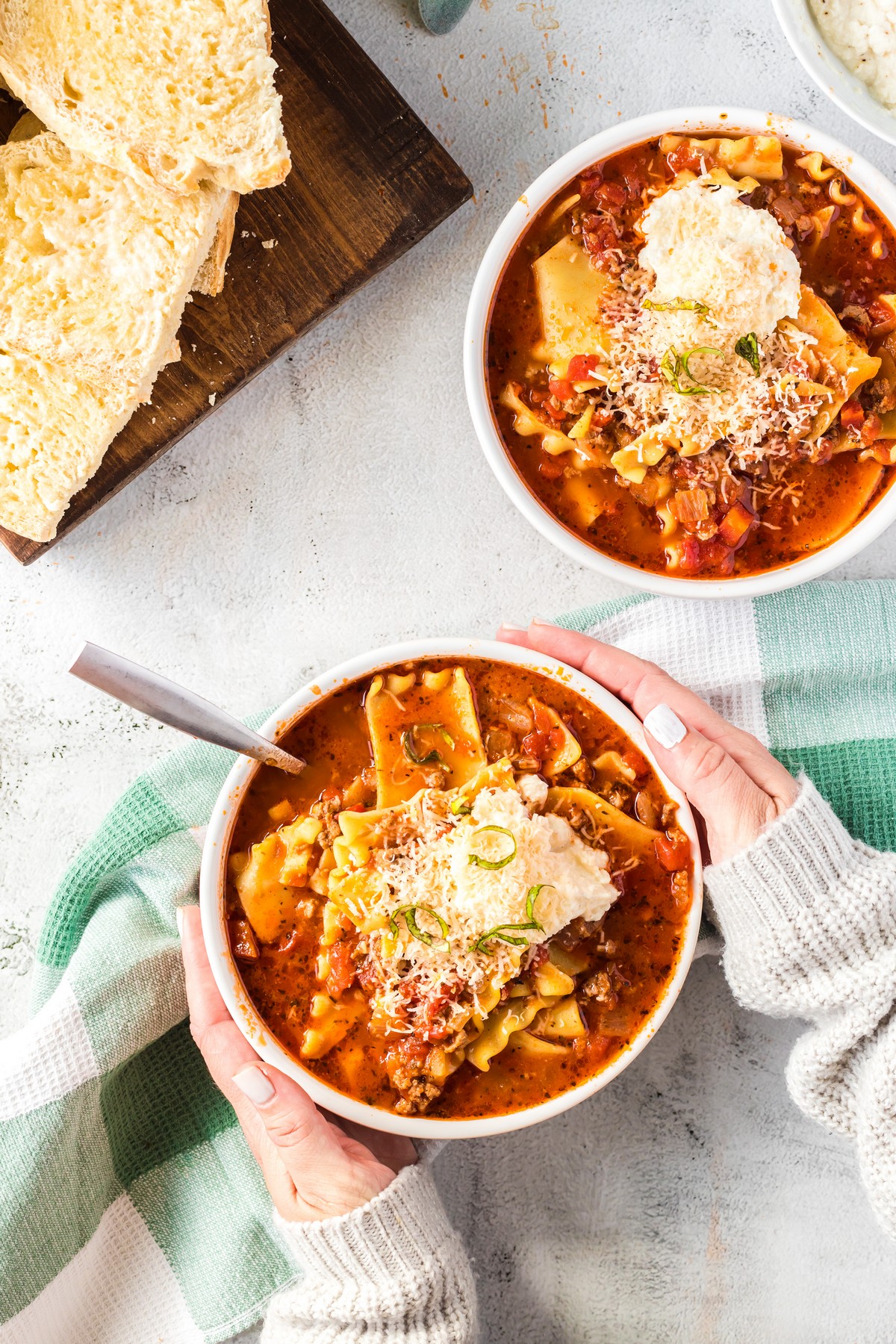 holding lasagna soup