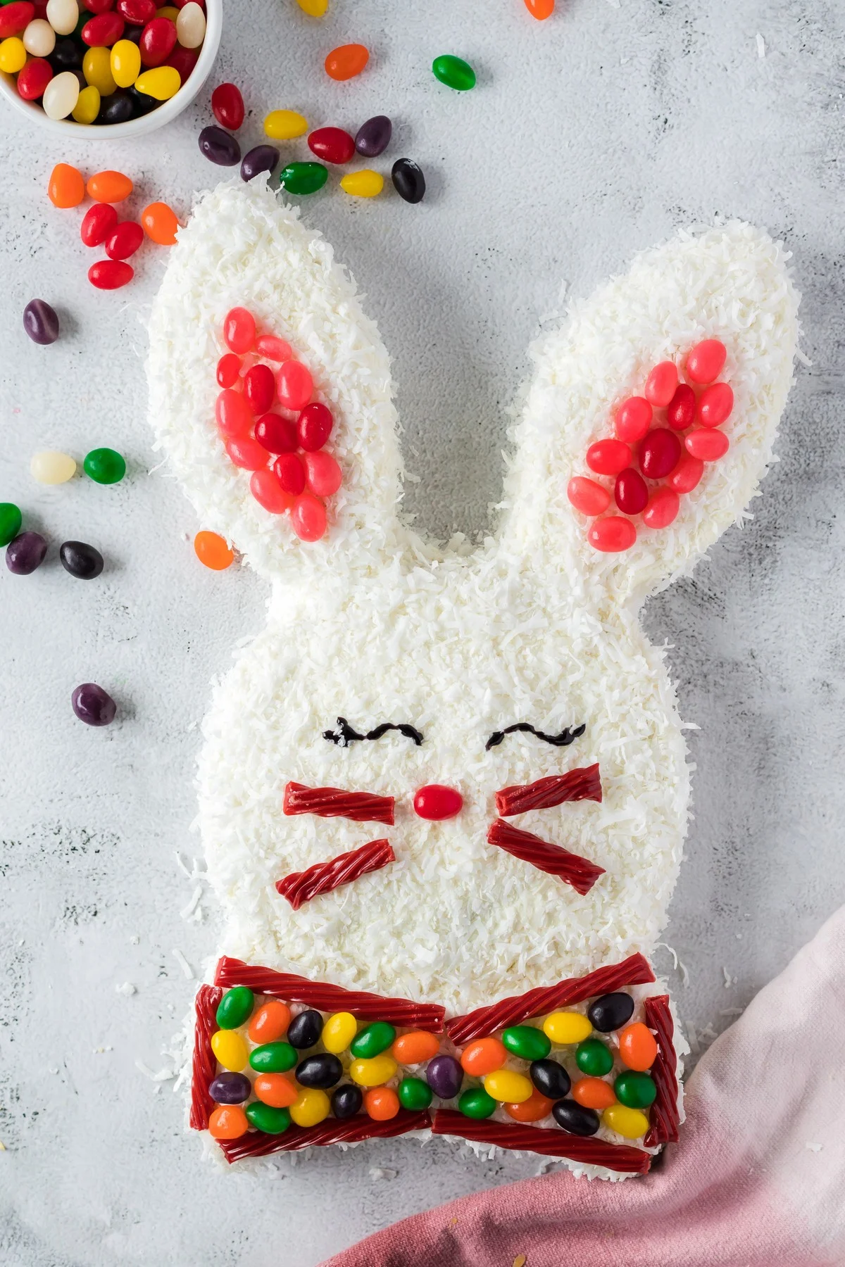 easter bunny cake with jelly beans as ears and bow tie, twizzlers as mouth