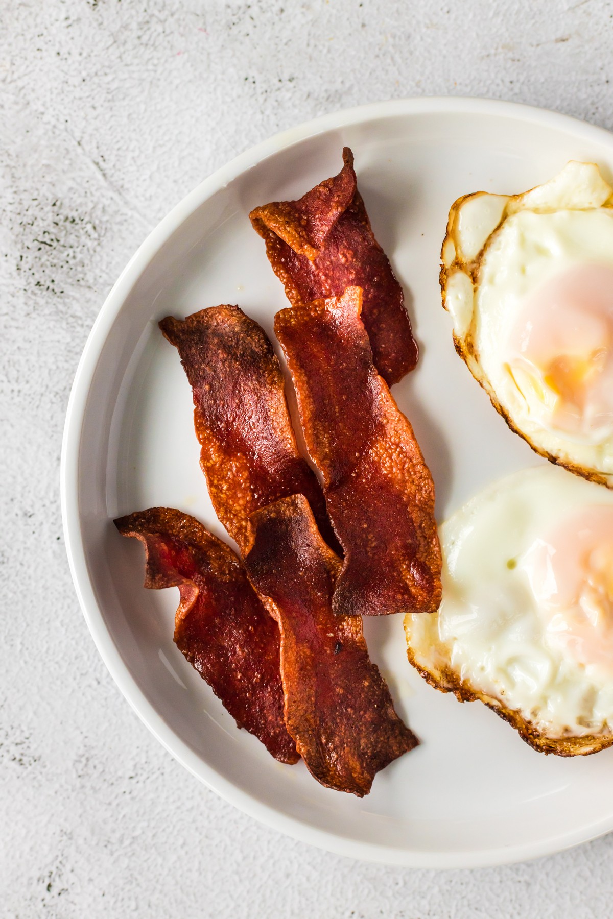 bacon and eggs on plate