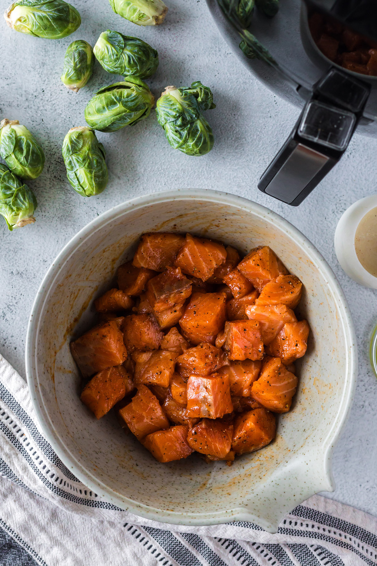 season salmon filet in bowl