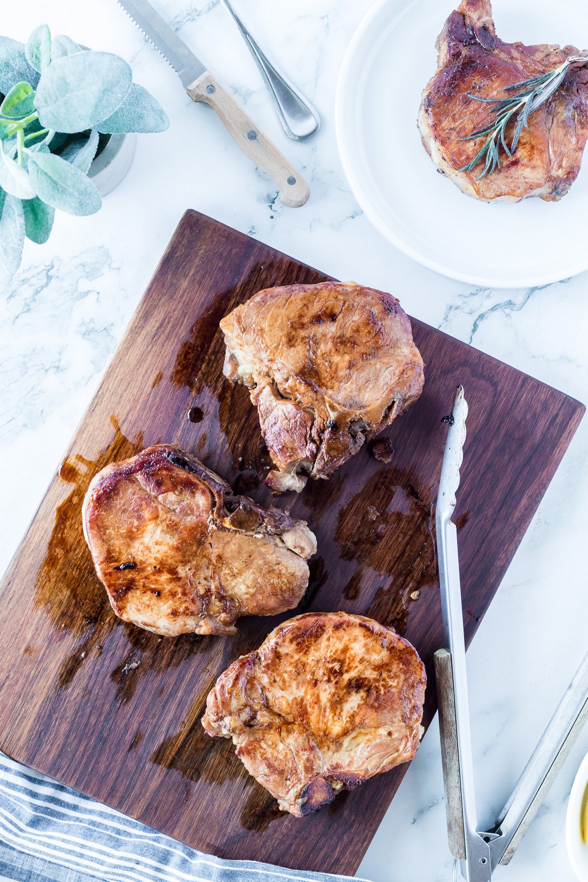 sliced pork chops on cutting board