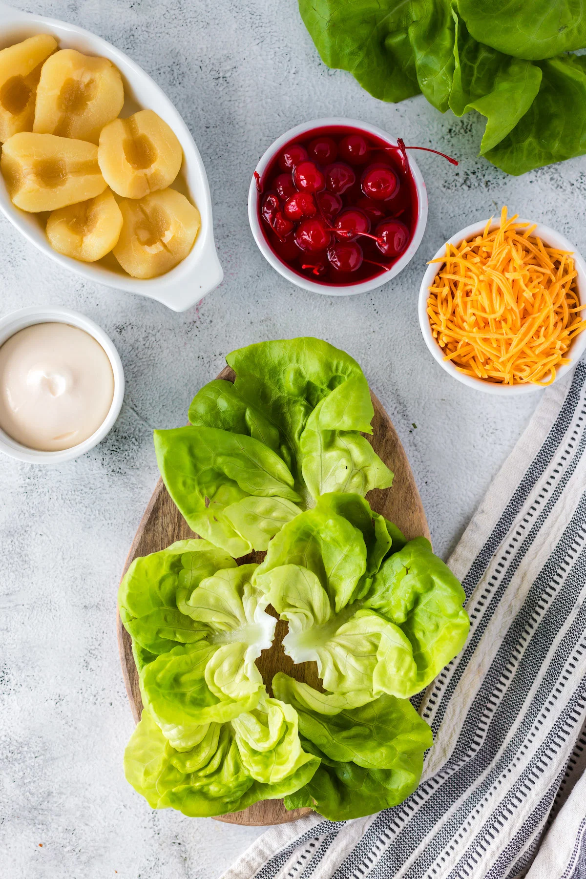 butter lettuce on cutting board to assemble pear salad