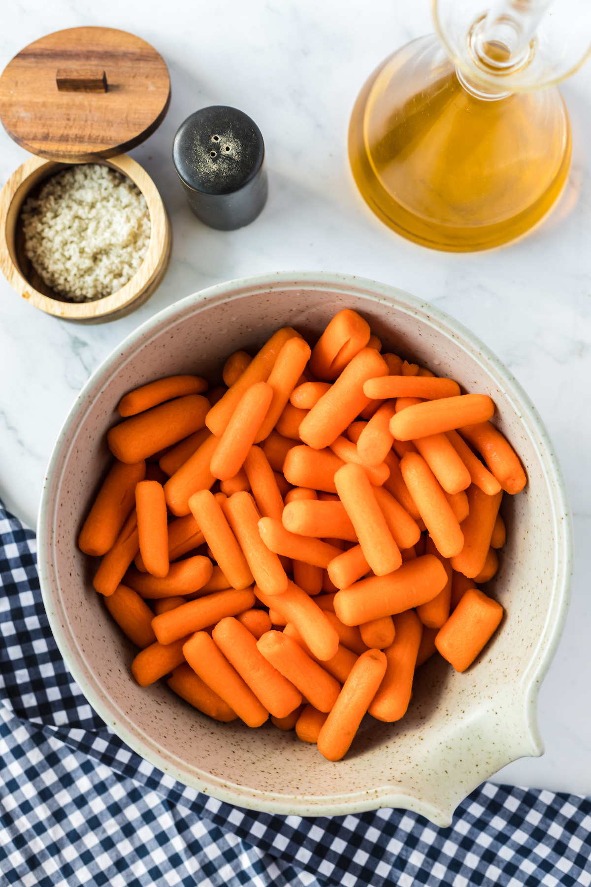 ingredients for oven roasted baby carrots on sheet pan