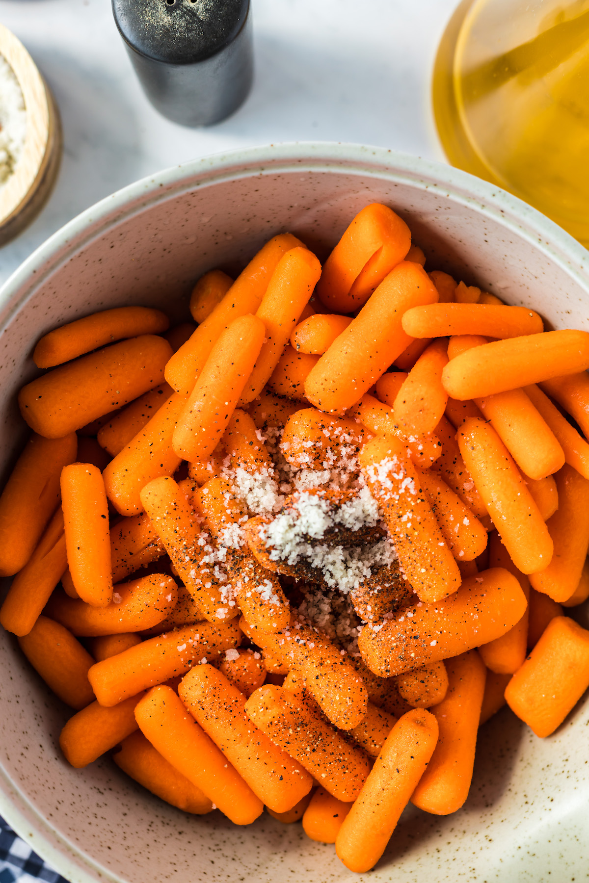 seasonings in bowl with baby carrots