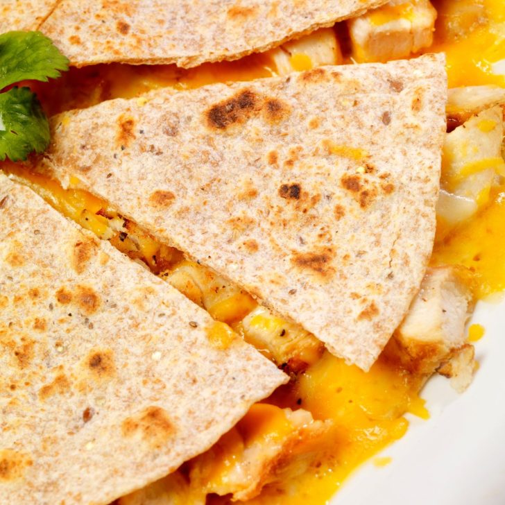 sliced quesadilla with chicken and cheese made in air fryer