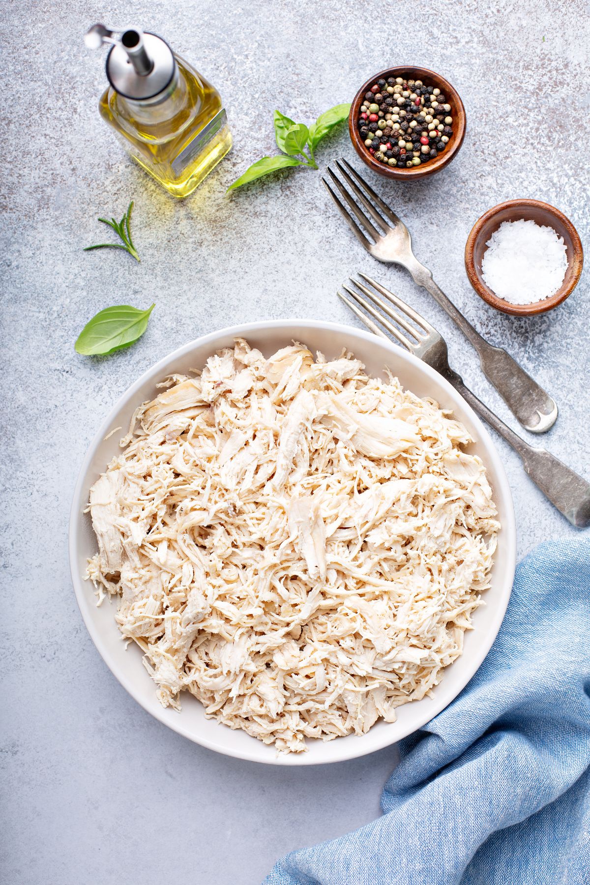 shredded chicken with seasonings and fork