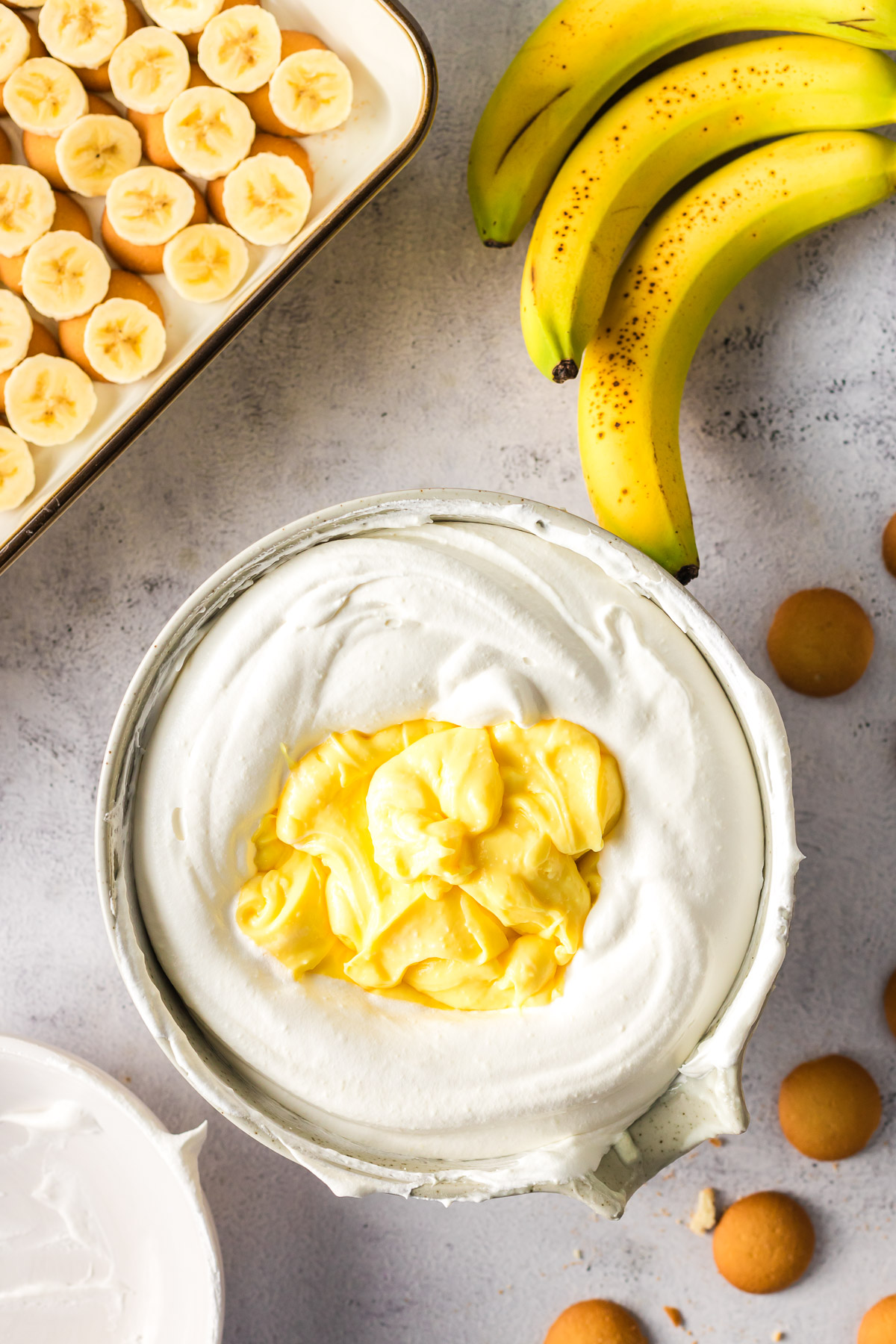 Combining the cream cheese mixture with the pudding mixture