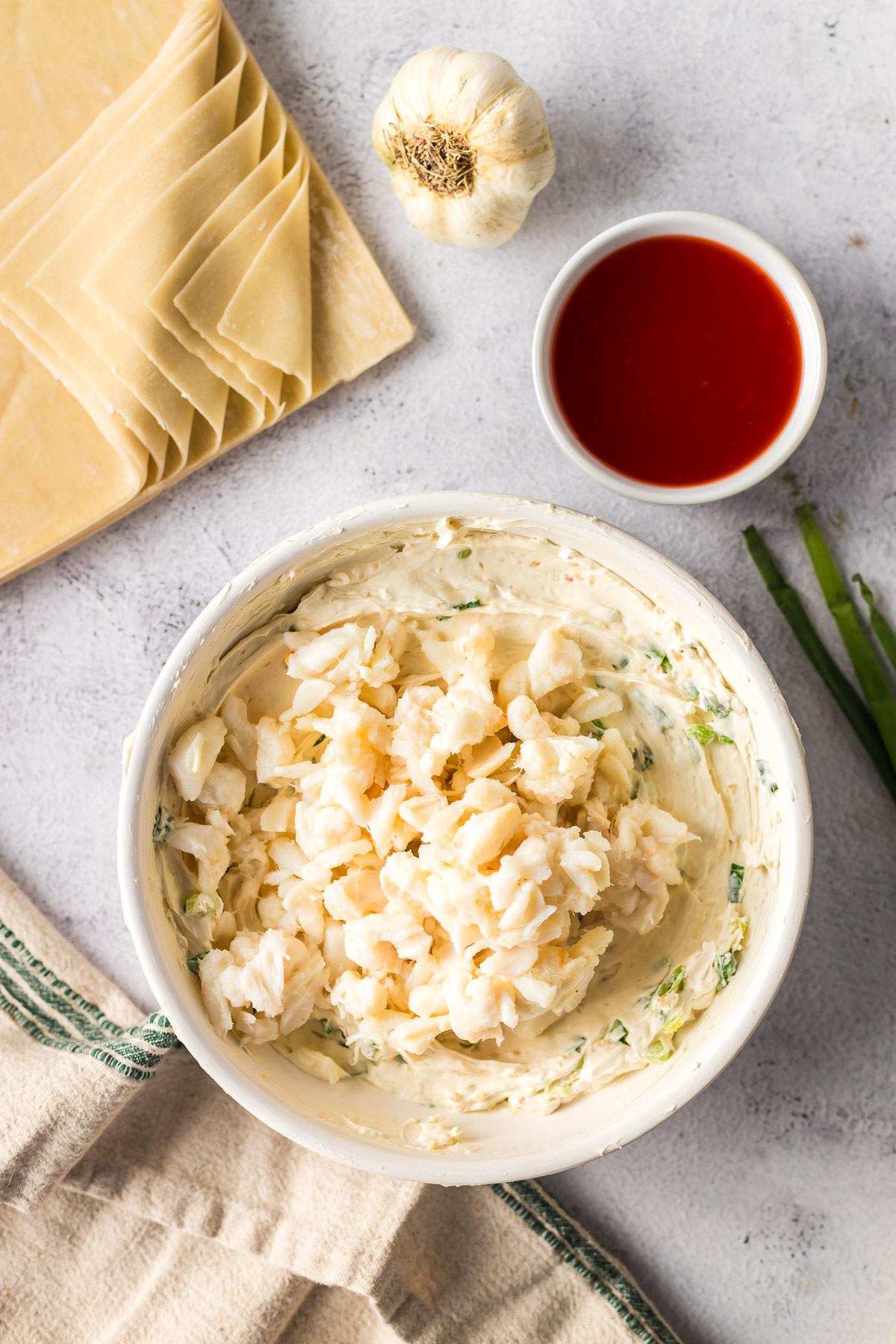 folding crab meat into cream cheese filling