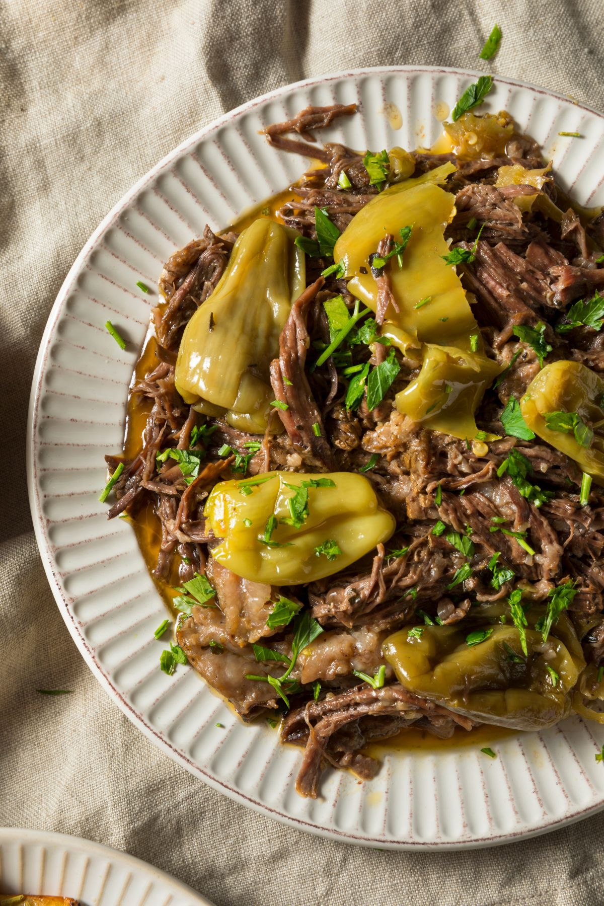 Mississippi pot roast shredded on white plate