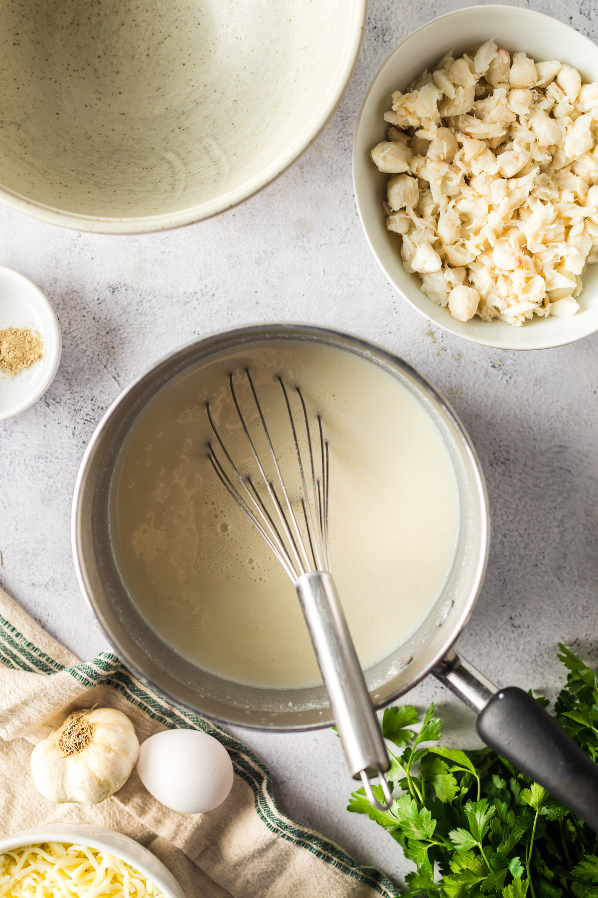 white sauce made with milk, flour, and parmesan cheese