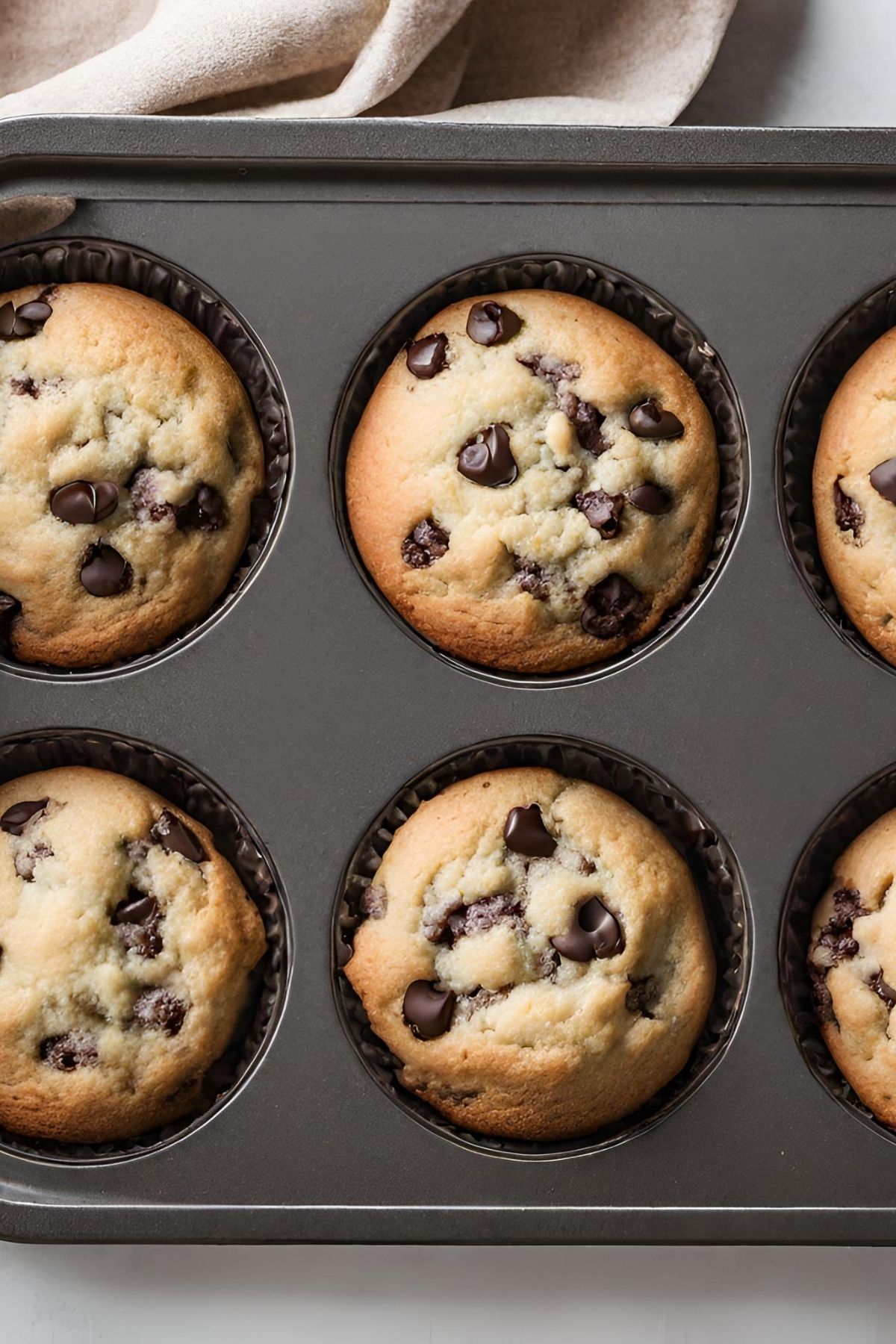 Banana Bread Muffins with chocolate chips in muffin tin