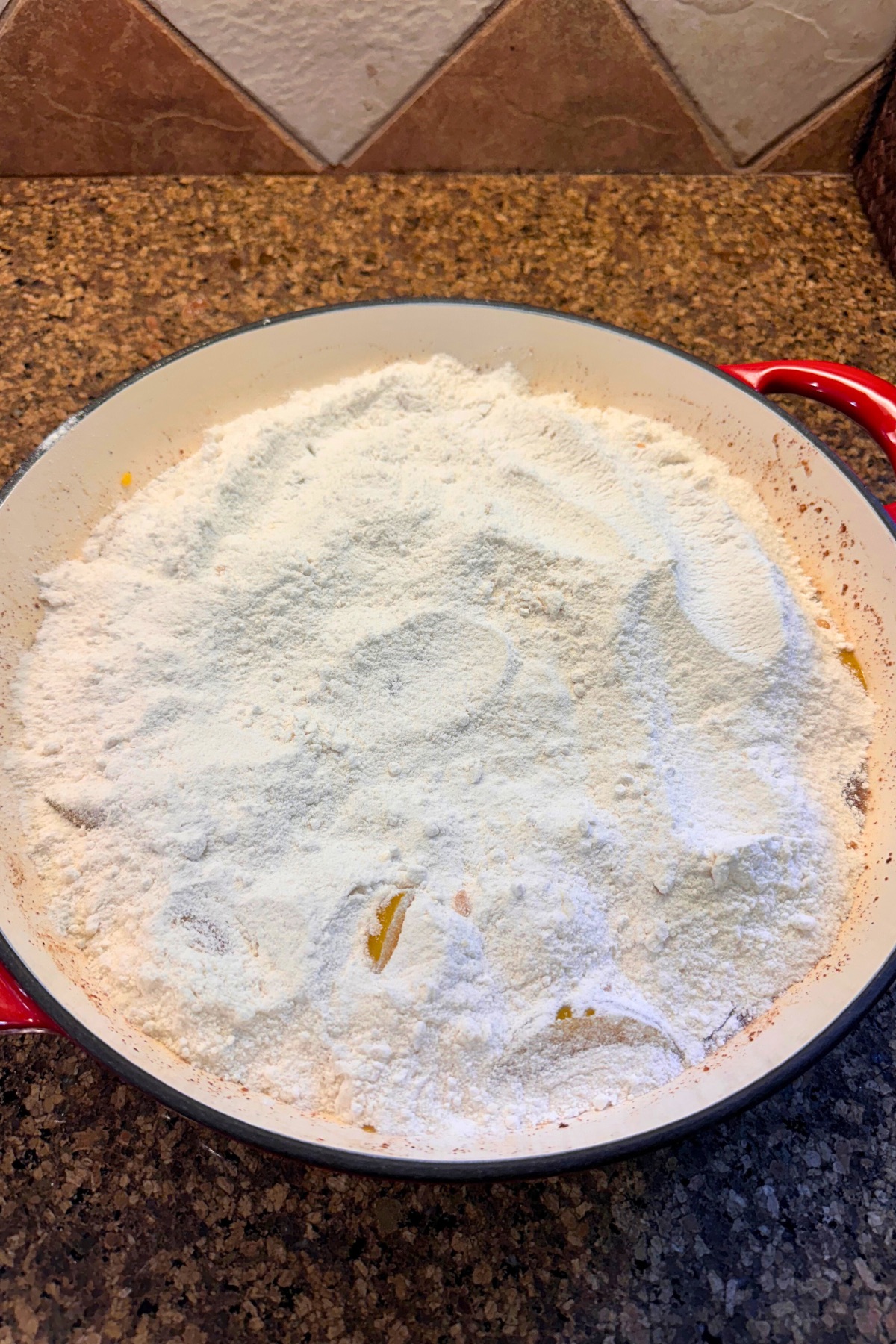 dry cake mix on top of peach cobbler filling
