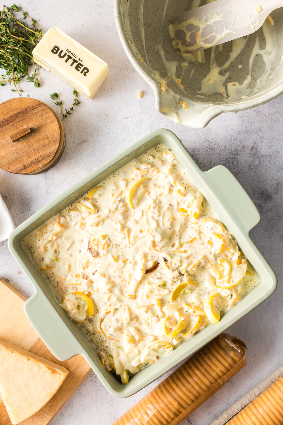 uncooked squash casserole in baking dish