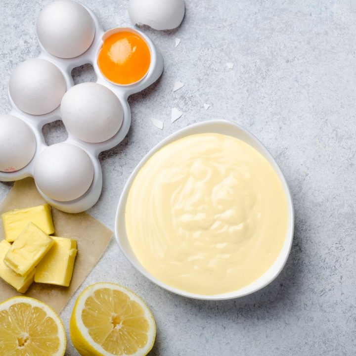 Bowl of hollandaise with ingredients