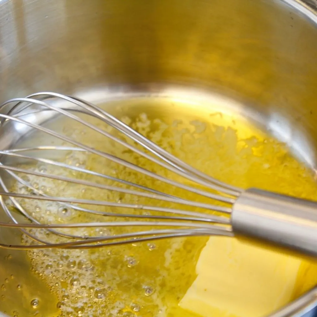 Melting butter in sauce pan with metal wire whisk