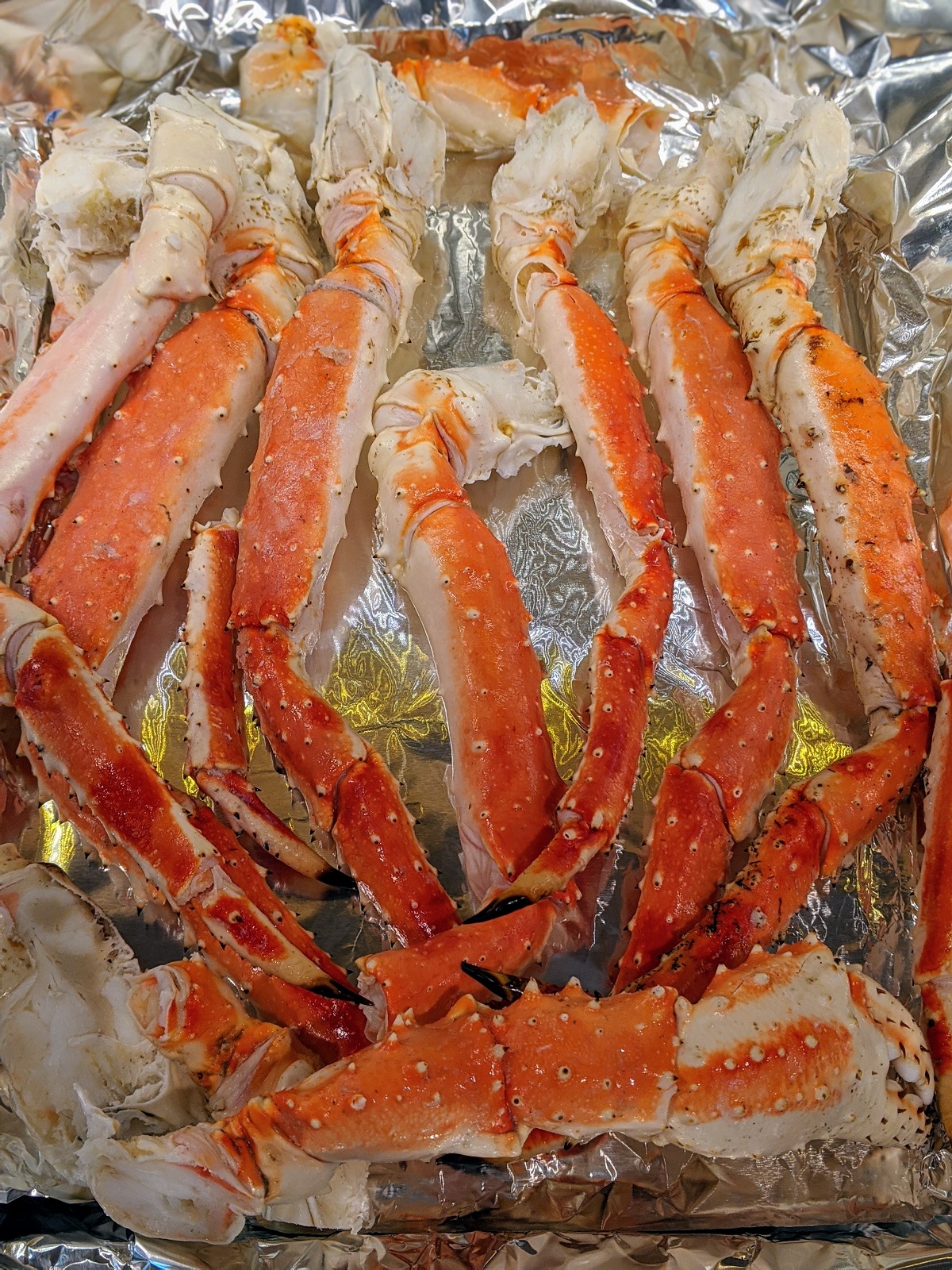 crab leg cluster on aluminum foil