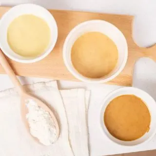 3 different types of roux on cutting board with spoon