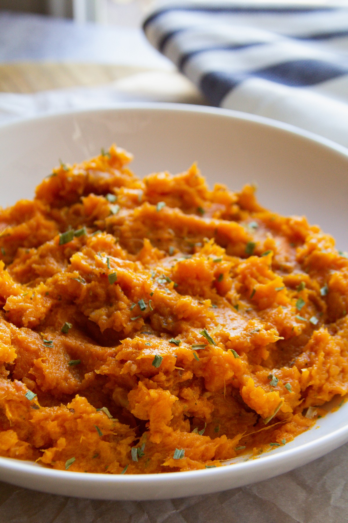 white bowl of mashed sweet potatoes 