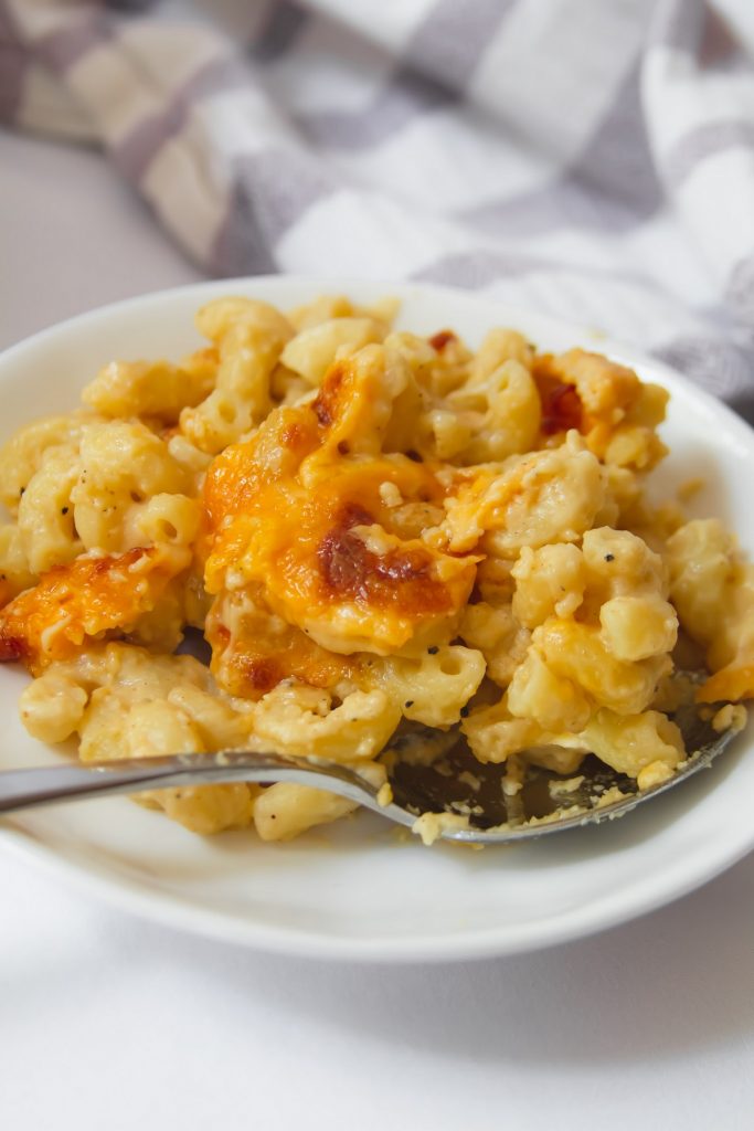 mac and cheese on a plate with spoon